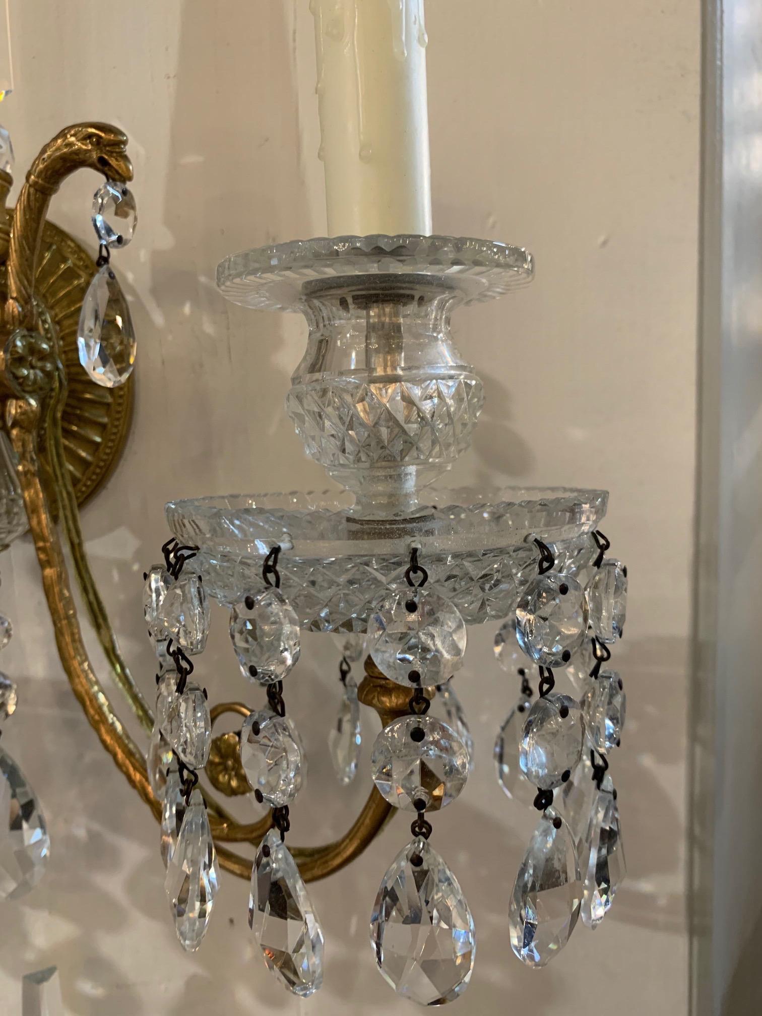 Beautiful 19th century French neoclassical gilt bronze and crystal sconces. Sparkling crystals on a lovely base. An instant Classic! Price listed is for a set of 2. There are 4 sconces available.