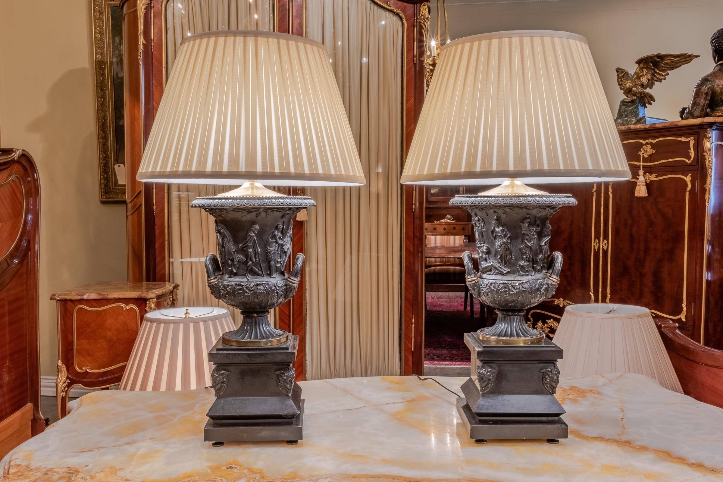 Beautiful pair of 19th century neoclassical bronze urns with classical Roman figures and partial gilt made into lamps. Attributed to Barbedianne.