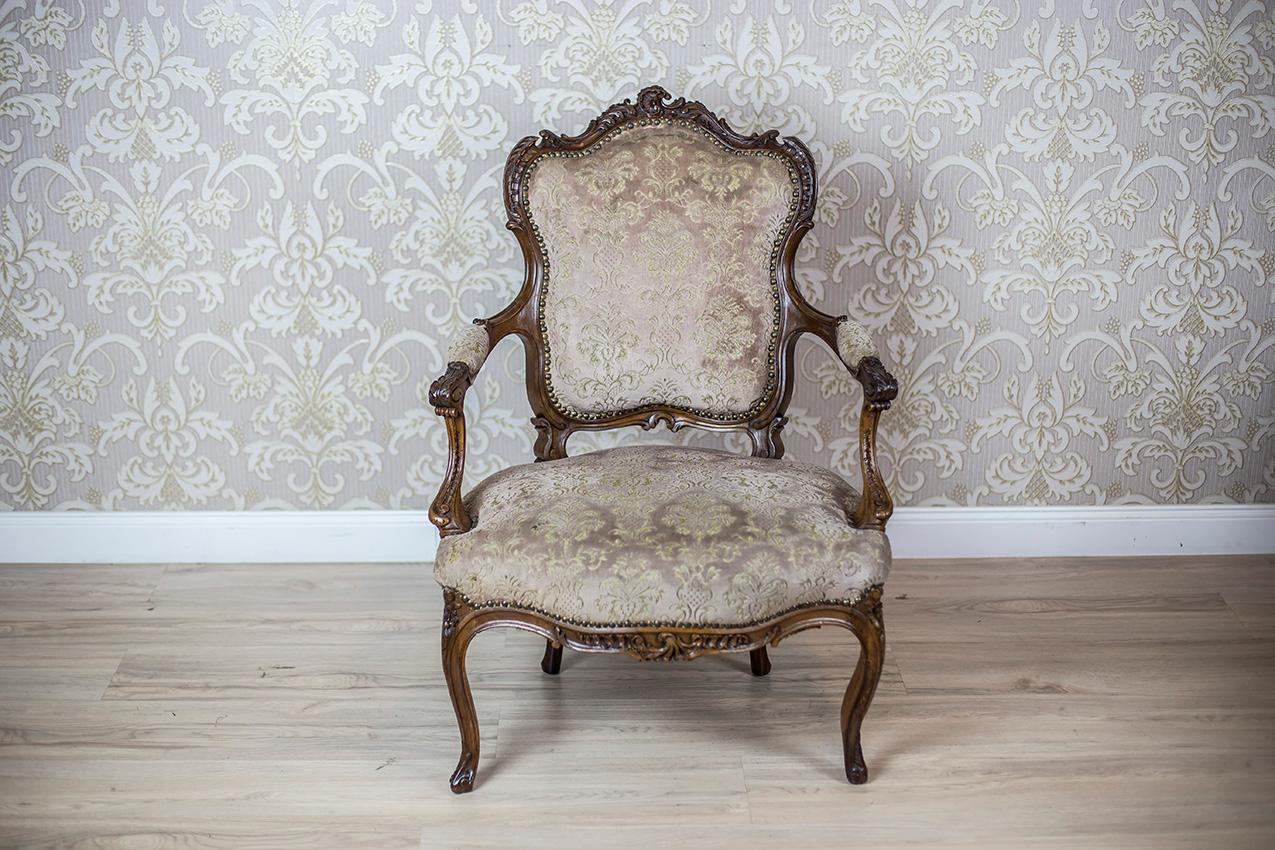 We present you a wooden armchair of a Neo-Rococo form with a softly upholstered seat. backrest, and armrests.
The wooden parts are richly decorated with carved patterns.

This piece of furniture is in very good condition. The woodwork has been