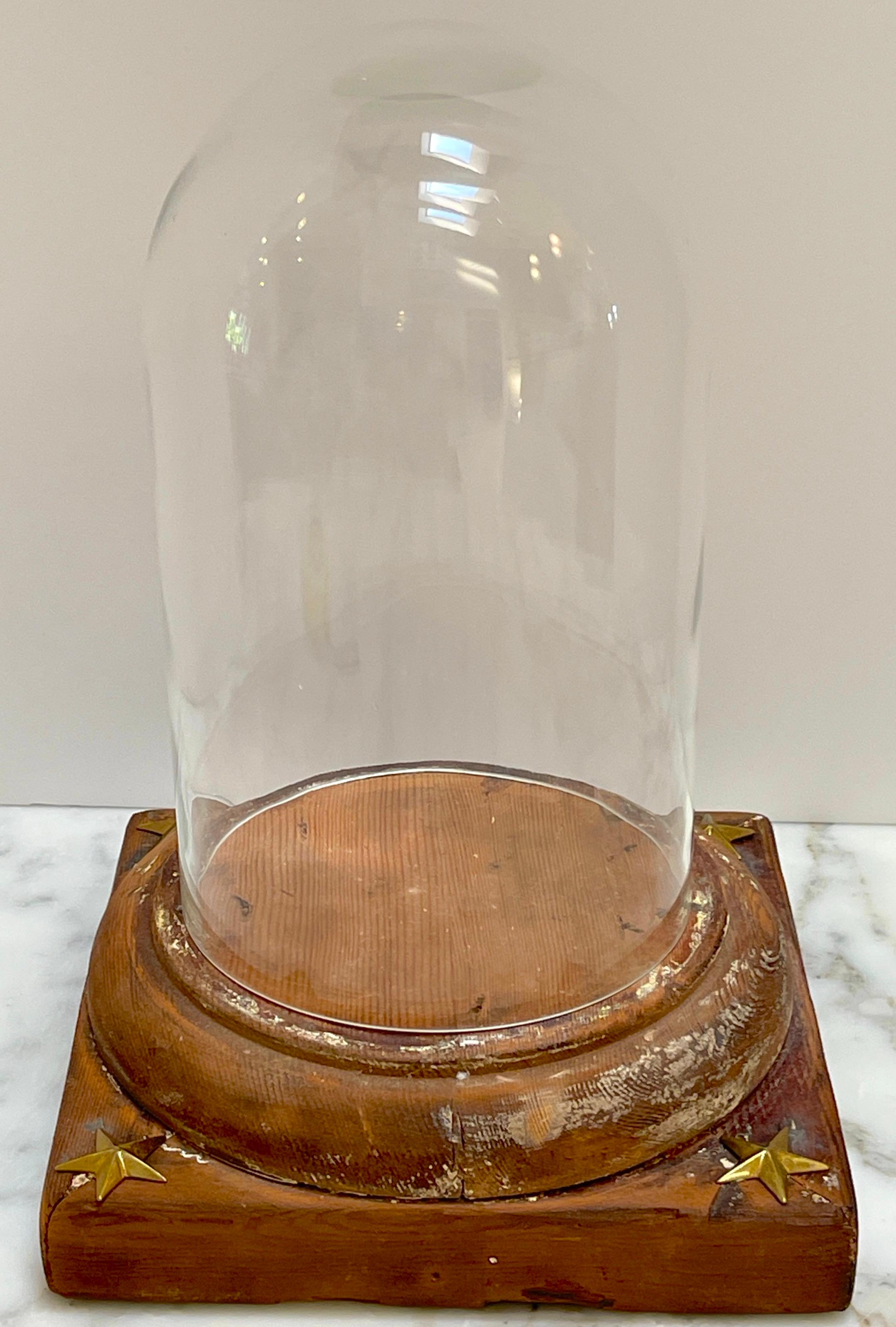19th Century French Neoclassical Distressed Wood & Glass Cloche/Dome 
France, 1890s

A stunning piece from 19th-century France, this neoclassical distressed wood and glass cloche/dome exudes timeless beauty and elegance. Crafted in the 1890s, this