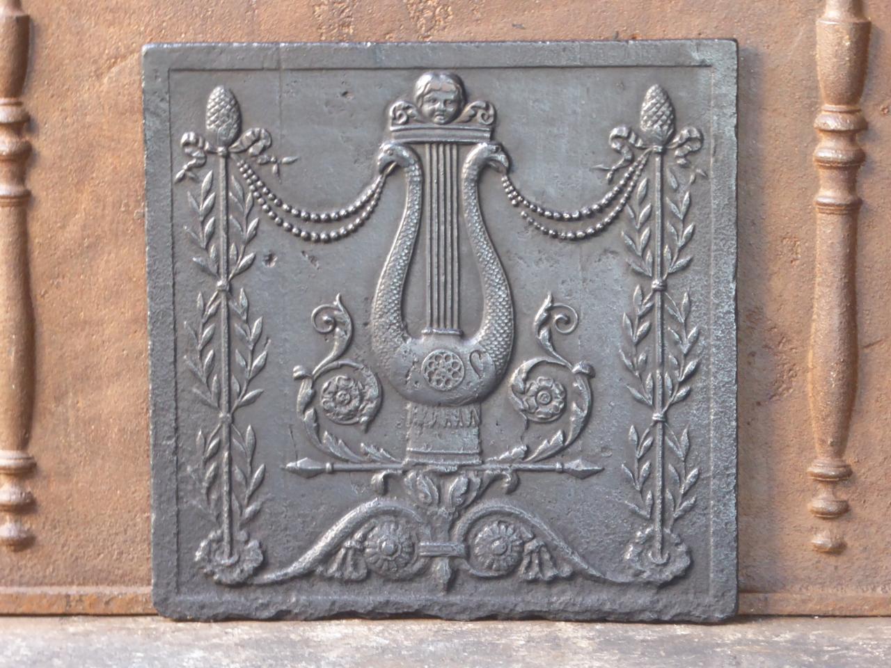 19th century French neoclassical fireback. The fireback is made of cast iron and has a black patina. It is in a good condition, without any cracks.
