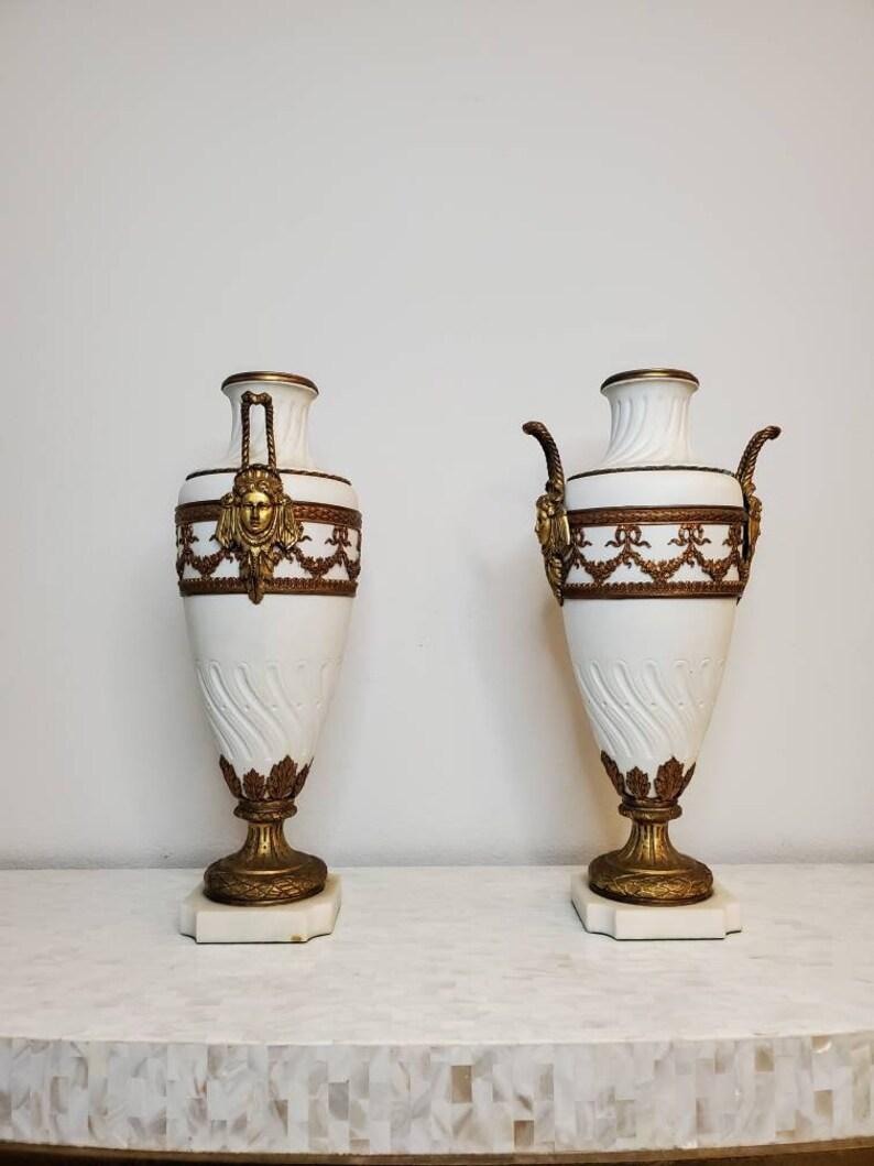 An exceptional matching pair of exhibition quality bisque porcelain urns / vases, very fine French work, elegant Louis XVI style, finished with luxurious Neoclassical taste, the magnificent, richly decorated ovoid form antique urns / vases adorned
