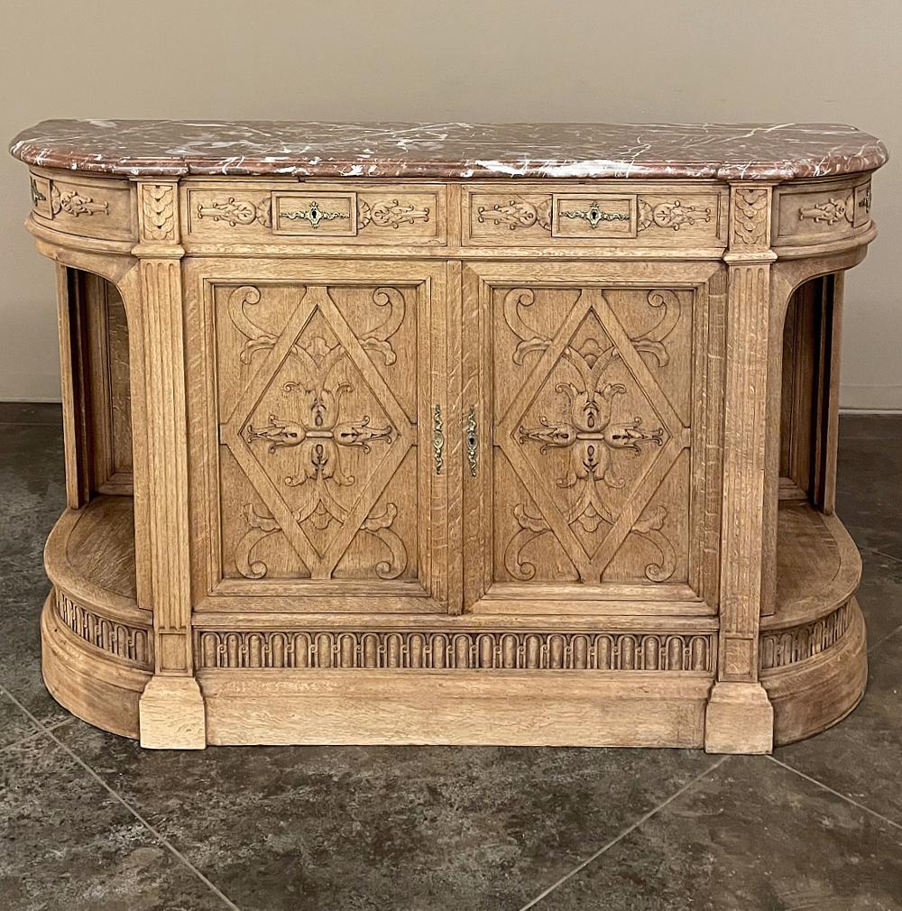19th Century French Neoclassical marble top buffet combines elegance with a soft, casual visual presence making it compatible with a wide variety of interior styles! The rounded sides belie the measurements, making it more space-friendly than the