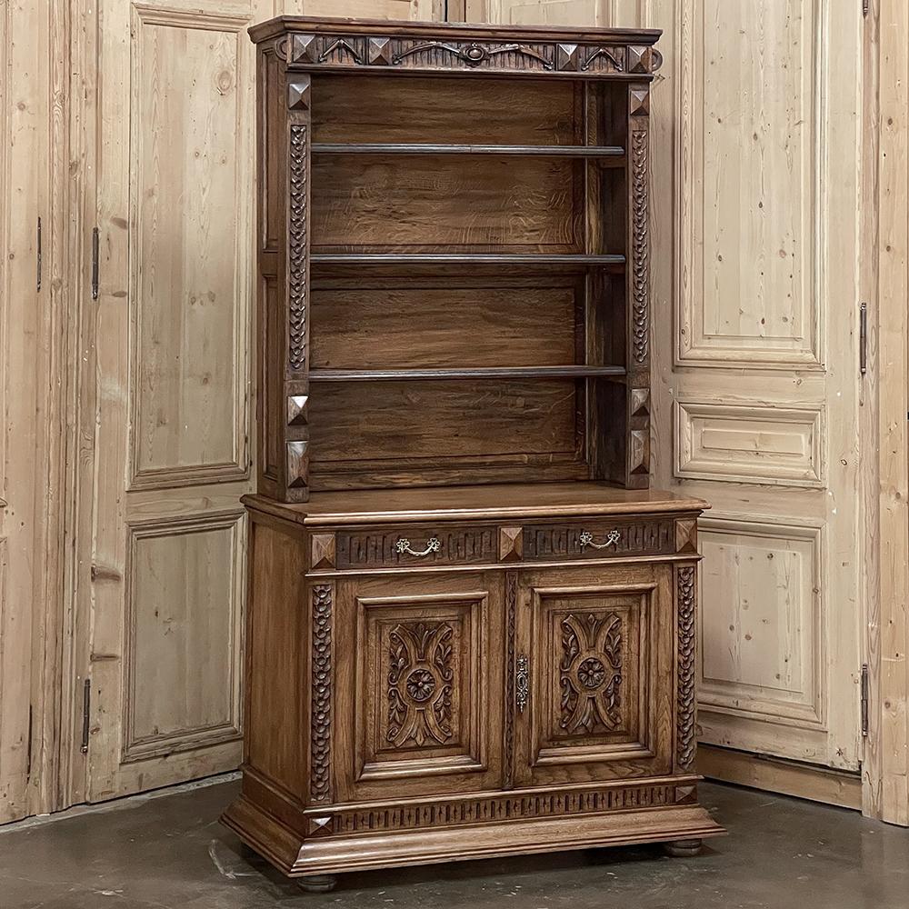 19th century French Neoclassical Open Bookcase is a magnificent work of the cabinetmaker's art, separated into an upper and lower tier that together create both display and storage in style! The crown features an intriguing design accented with