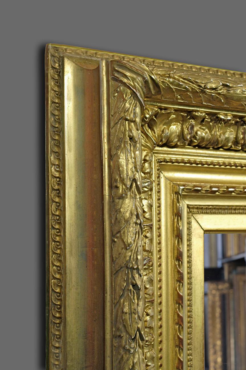 A very and well preserved second half of the 19th century French Neoclassical Revival Salon frame. It has a compound ogee section with the following ornament applied in moulded Plaster of Paris: leaf-tip; ribbon; beading; acanthus leaf-&-flower