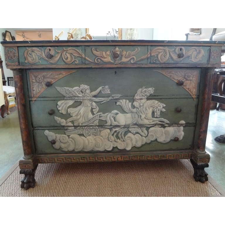 19th century French neoclassical style painted commode.
Stunning 19th century French Neoclassical walnut commode or chest of drawers with three small drawers above three larger drawers with faux marble top resting on paw feet. This commode is