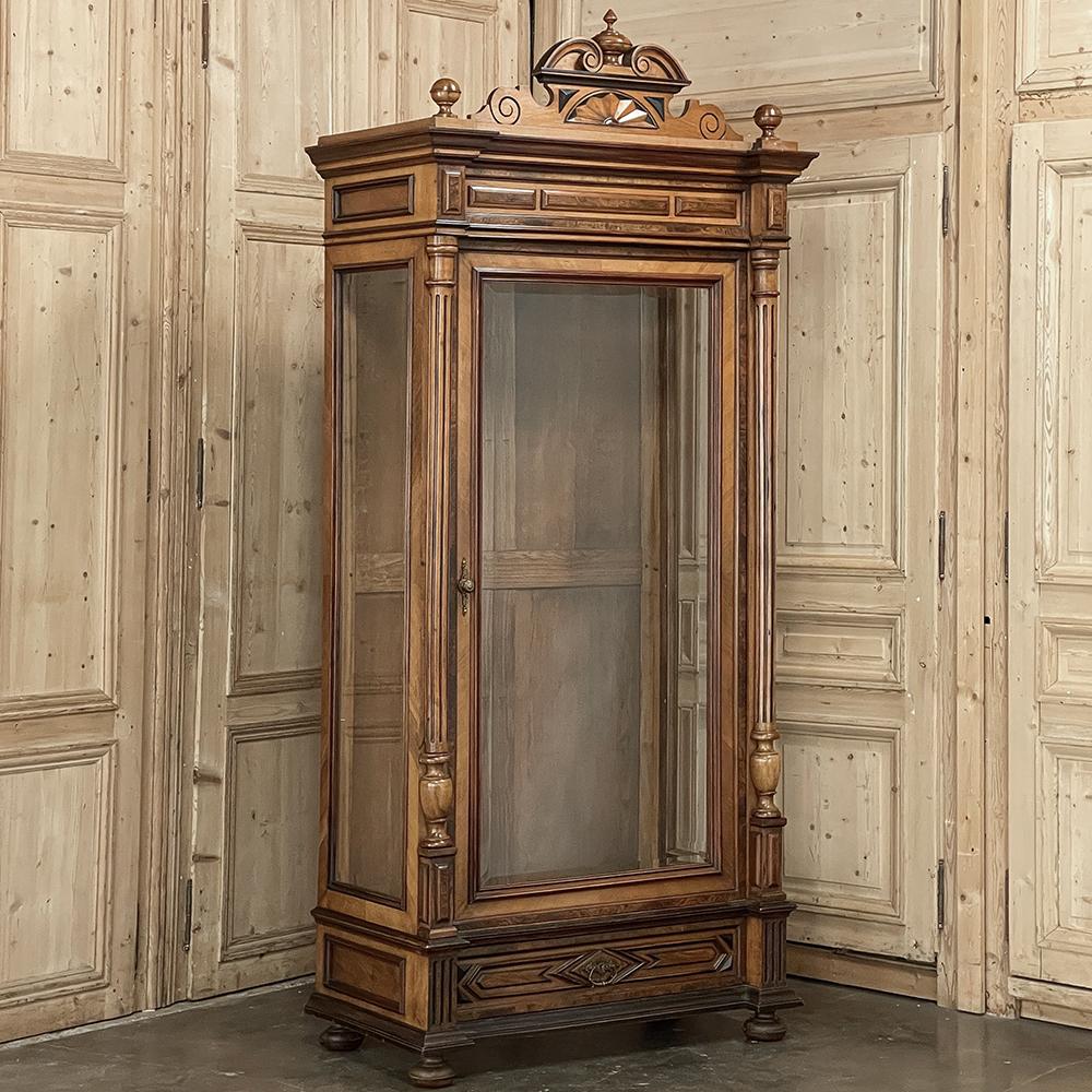 19th century French Neoclassical Walnut Display Armoire ~ Bookcase was crafted from blonde French walnut creating a naturally lighter shade of furnishing that is ideal for today's airy, casual decors. Taking a cue from 3,000 years of classical
