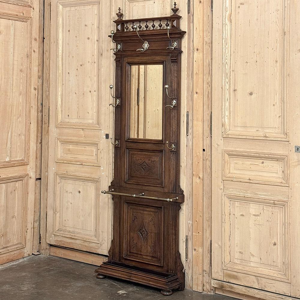 19th Century French Neoclassical Walnut Hall Tree is the perfect piece to greet family and guests in your entryway!  Designed to take up a minimum of floor space, this one is also unusually narrow, making it ideal for its original purpose, or to