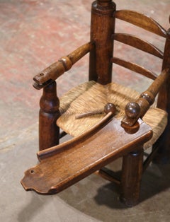 19th Century French Normandy Carved Oak Child Feeding Chair with Rush Seat