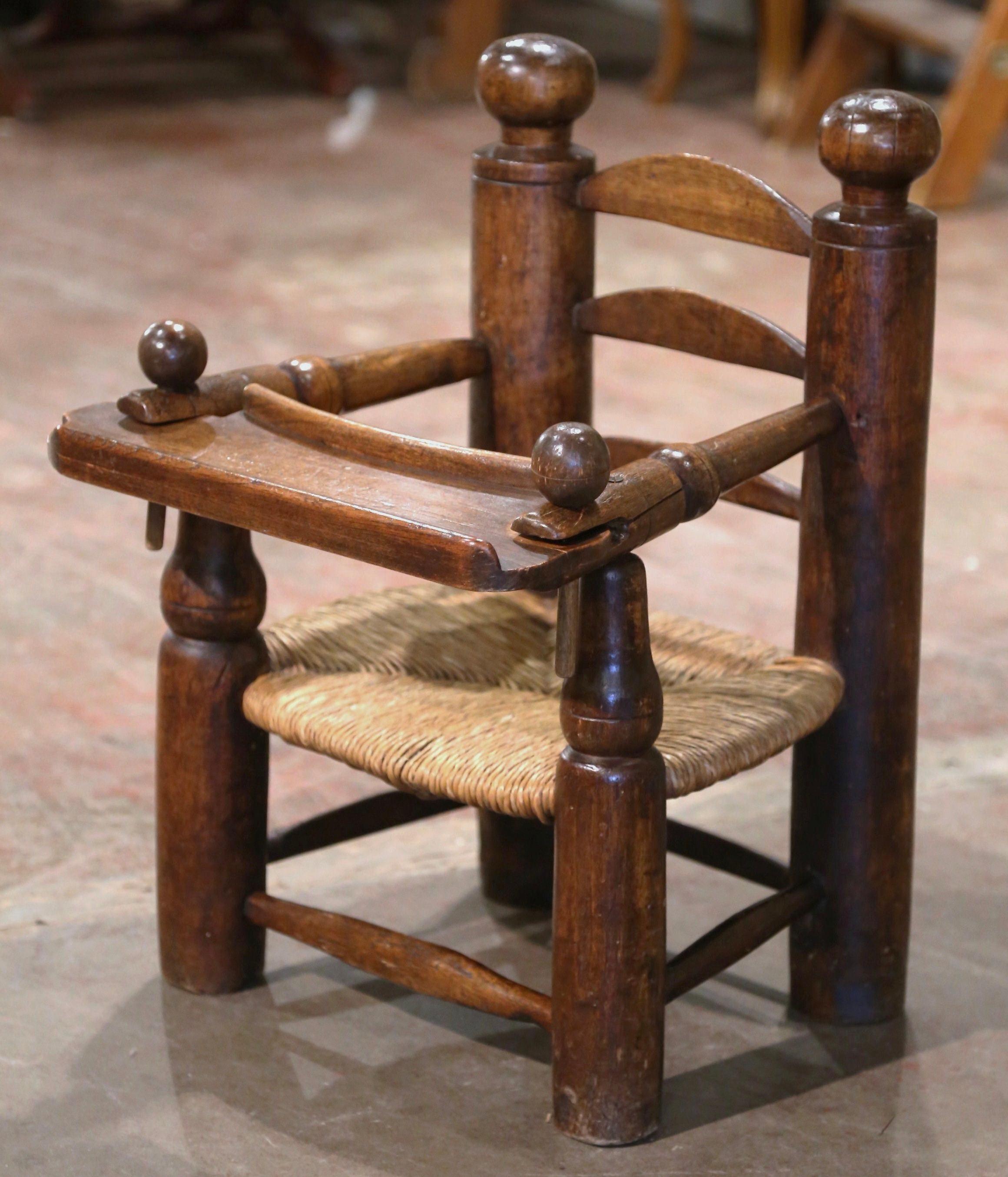19th Century French Normandy Carved Oak Child Feeding Chair with Rush Seat  In Excellent Condition For Sale In Dallas, TX