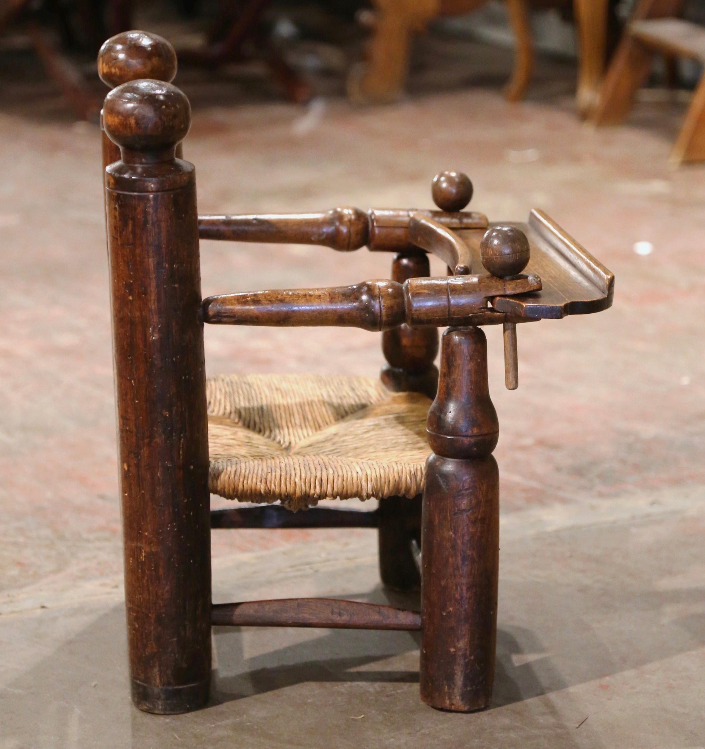 19th Century French Normandy Carved Oak Child Feeding Chair with Rush Seat  For Sale 4