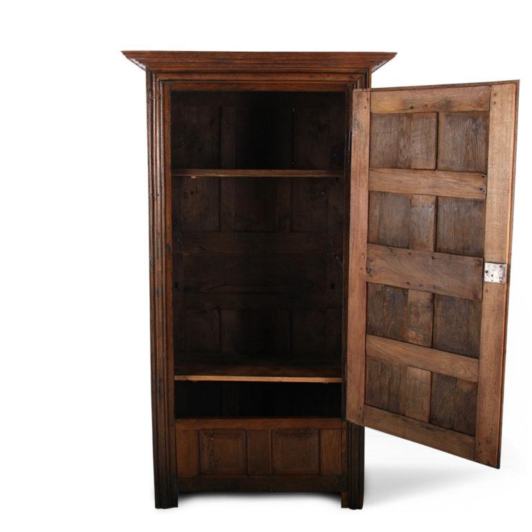 A rustic French country single door armoire or ‘bonnetiere’, the door comprised of eight raised panels within frames, the sides also of solid frame-and-panel construction.
Two interior shelves currently fitted; more can be produced, or a rod fitted
