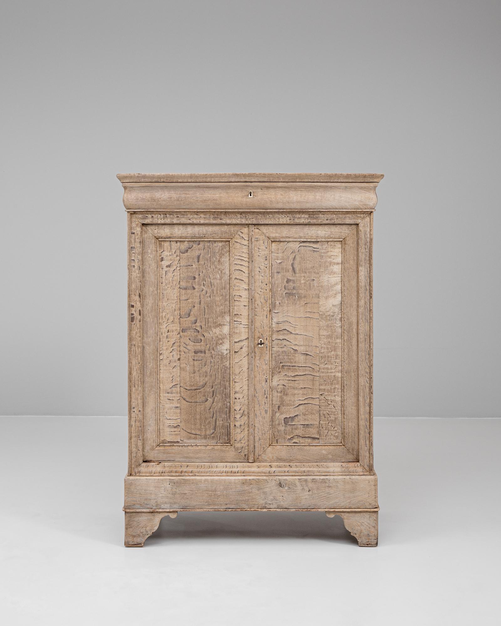 This 19th century French oak buffet blends rustic elegance with timeless craftsmanship. Made from solid oak, the piece features a beautifully weathered surface with rich grain patterns and subtle, natural distressing that highlight its age and