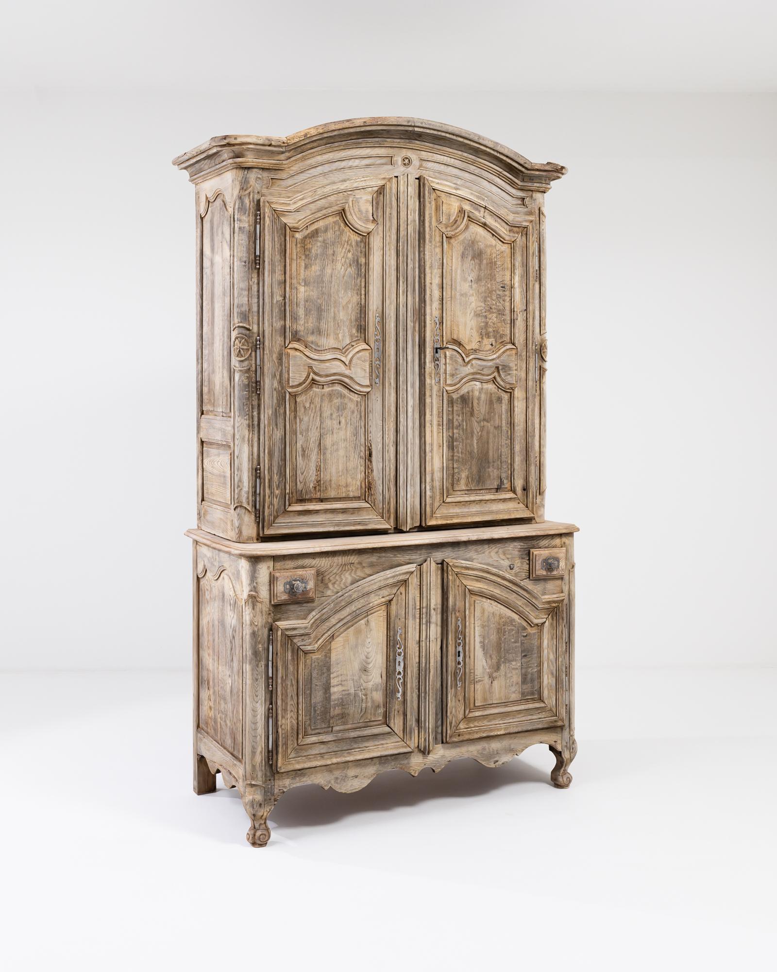 A wooden cabinet from 19th century France. This expansive cabinet is composed ‘a deux corps’ the upper and lower cabinets offering plenty of built-in shelves. The oak, which has been brought to new life in our atelier, was constructed with careful
