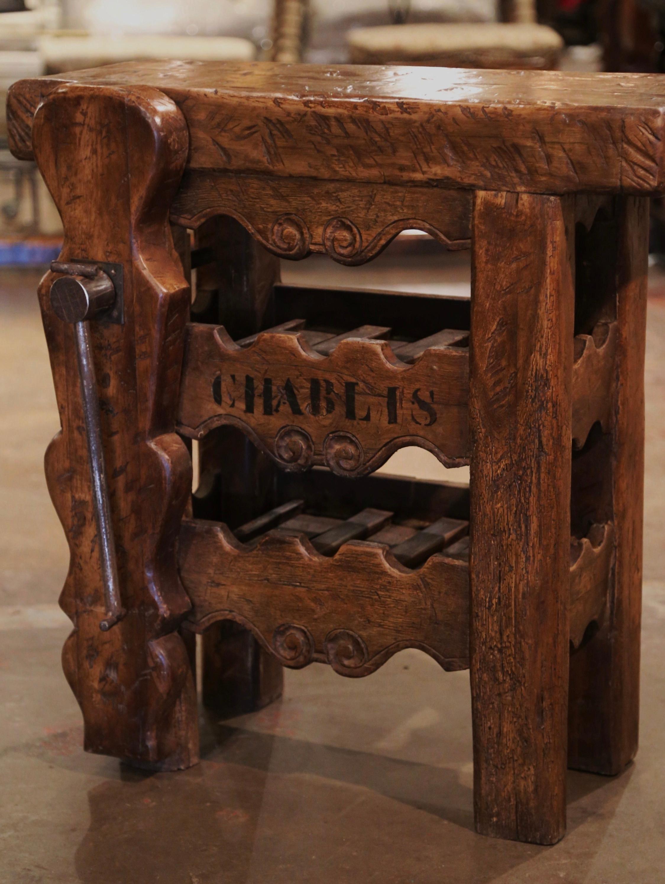 This antique table was crafted in the Poitou region of France, circa 1880. The rustic, oak piece decorated with the word 