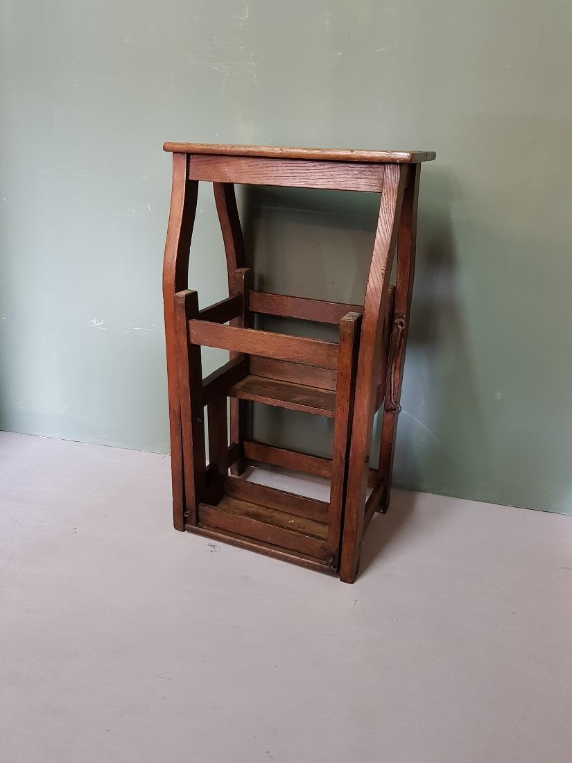 Antique French oak wooden metamorphic stool and kitchen stairs, the staircase can turned outside the stool and can be secured with a metal hook, it got a beautiful patina by use through the years, made in the 19th century.

The measurements