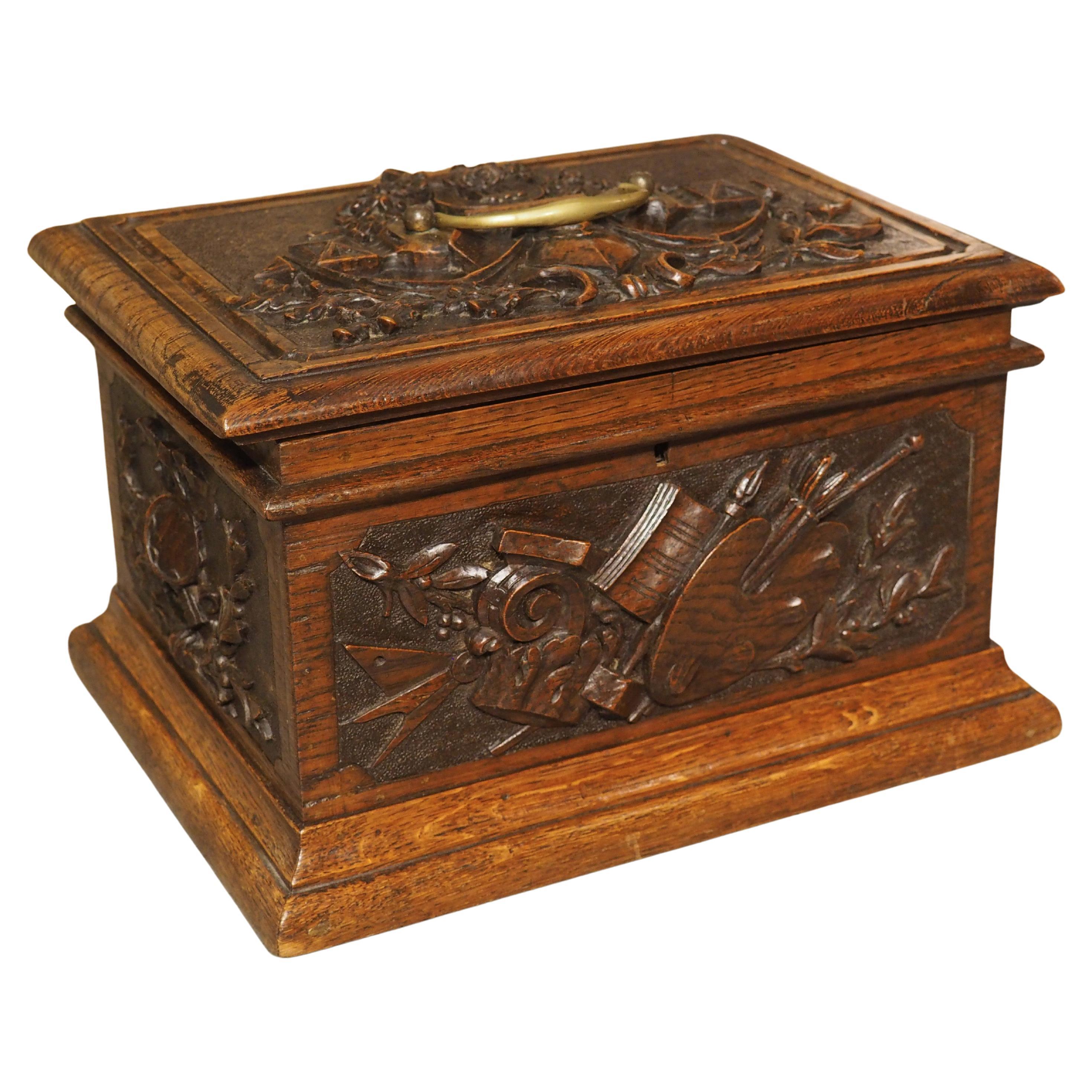 19th Century French Oak Table Coffret Box with Relief Trophy Carvings