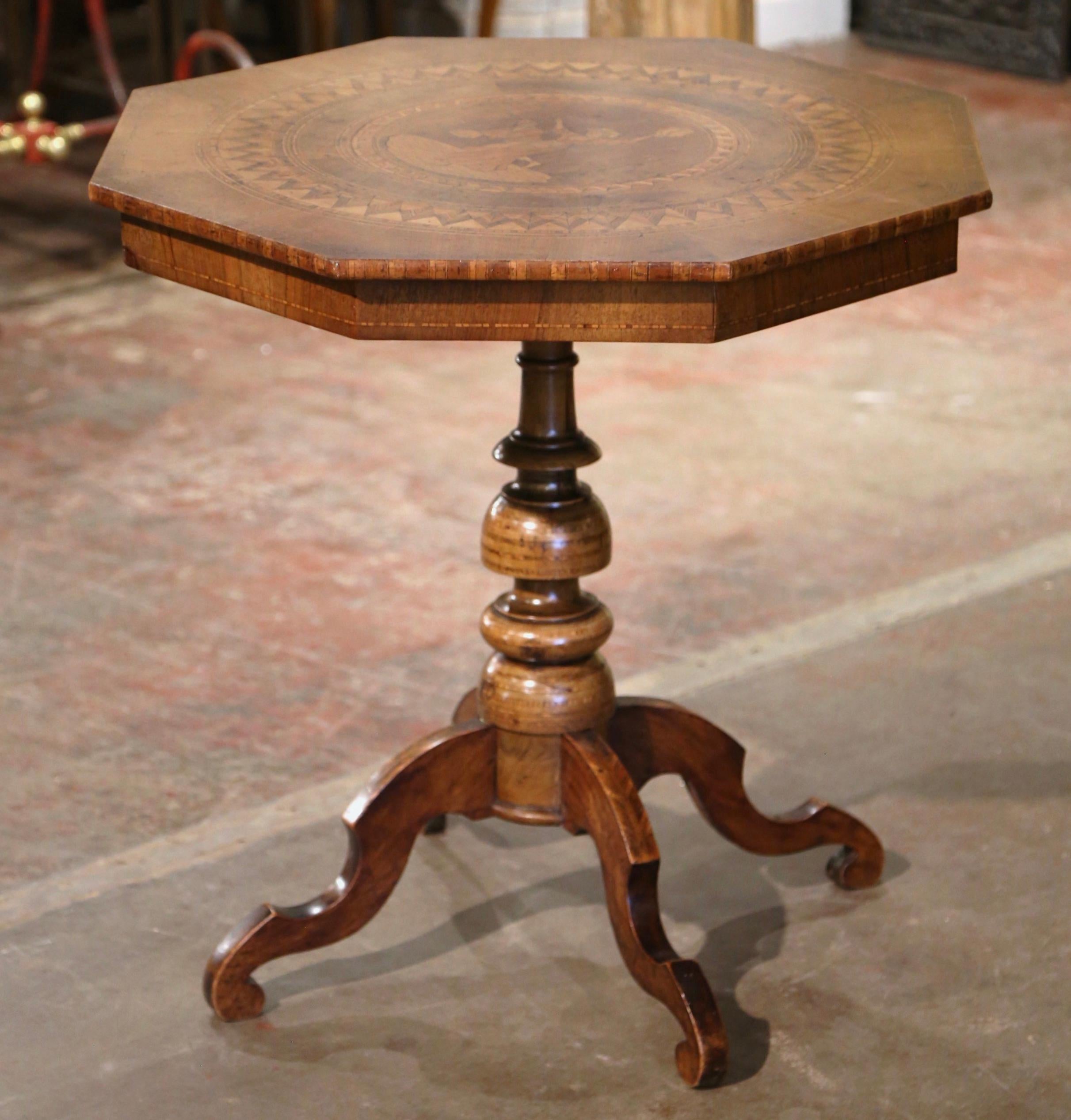 Incorporate extra surface space into your living room with this antique fruit wood gueridon table. Crafted in France circa 1870, the octagonal gueridon stands on a carved pedestal base with turned stem and ending with four scroll feet at the bottom.