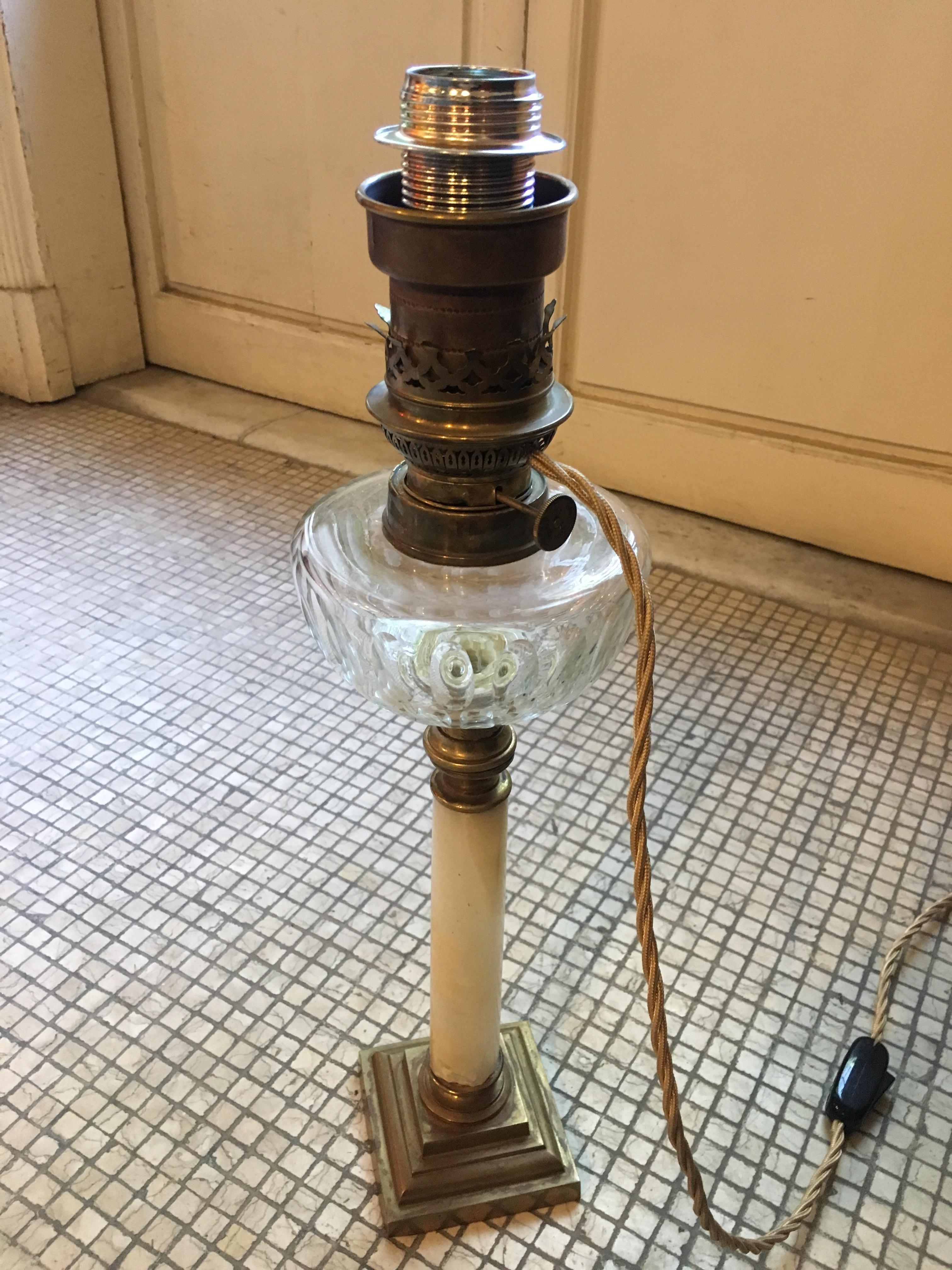 19th century French oil lamp with glass ampoule and marble stem converted into electric lamp, 1890s.
(This lamp has an electrical system according to European legislation).
 