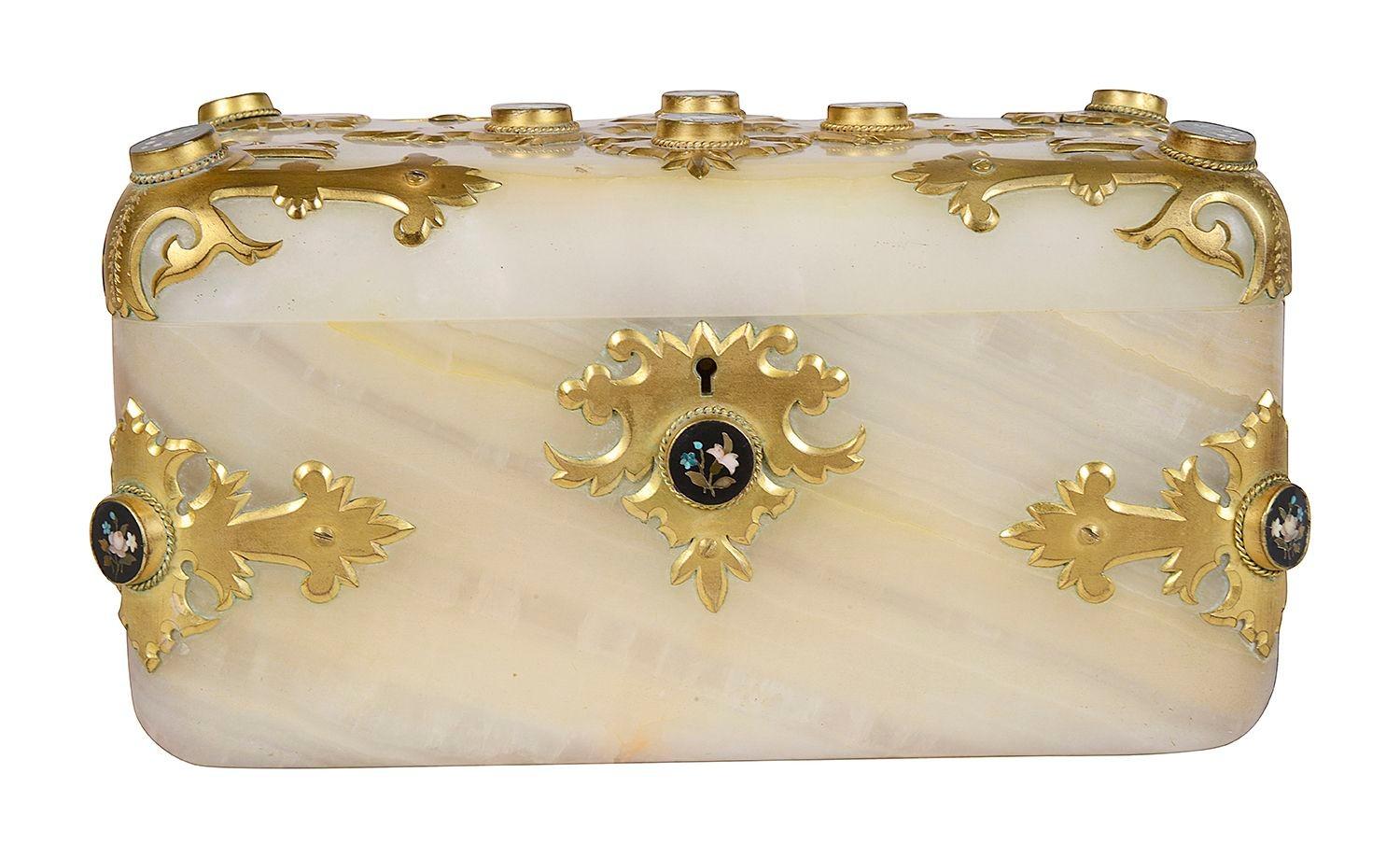 A very good quality French 19th Century onyx, ormolu mounted jewellery casket, having Pietra dura floral plaques to each corner, set into classically shaped gilded ormolu mounts.

Batch 76 c/c G9862/22 SKNZ