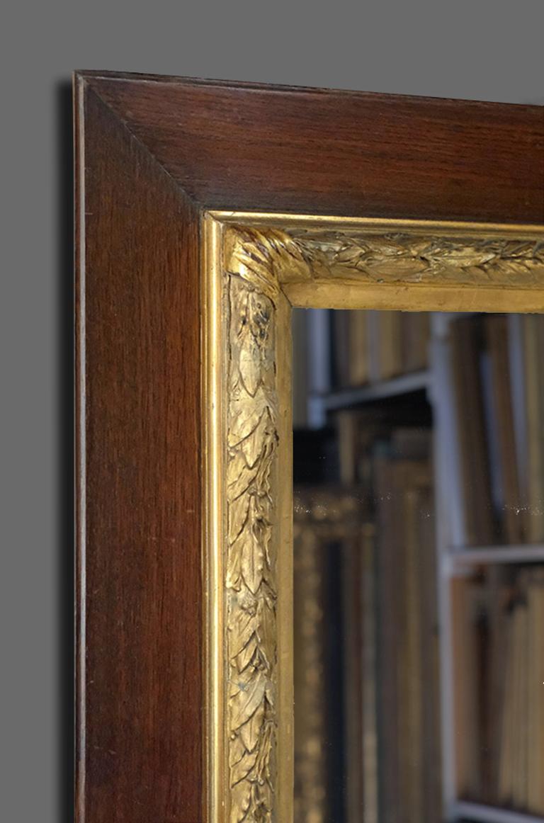 A beautiful and ornate 19th century French orientalist salon frame in oak, with an architrave profile. The ornament is in molded plaster of Paris: corner-&-centre bound torus of imbricated berried laurel leaves with canted sight frieze. The frame
