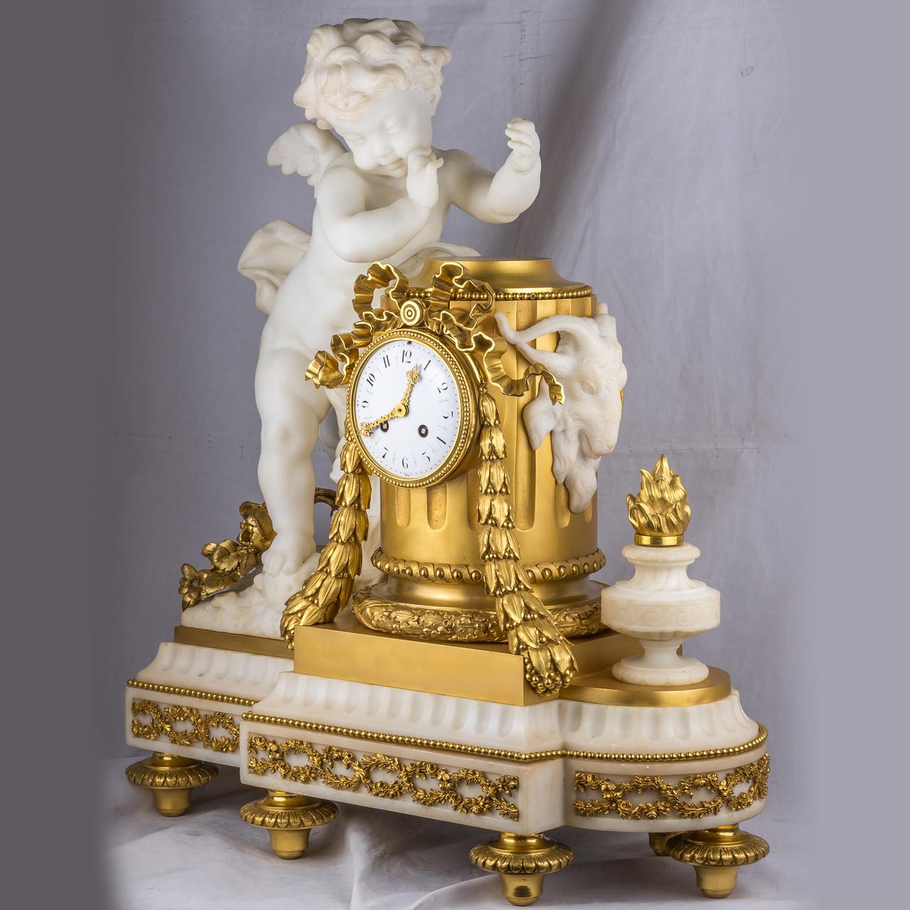 Exquisite Quality French Ormolu and White Marble Winged Cherub Clock.

Date: 19th century
Origin: French
Dimension: 25 1/2 in. high, 23 in. wide, 10 1/2 in. deep