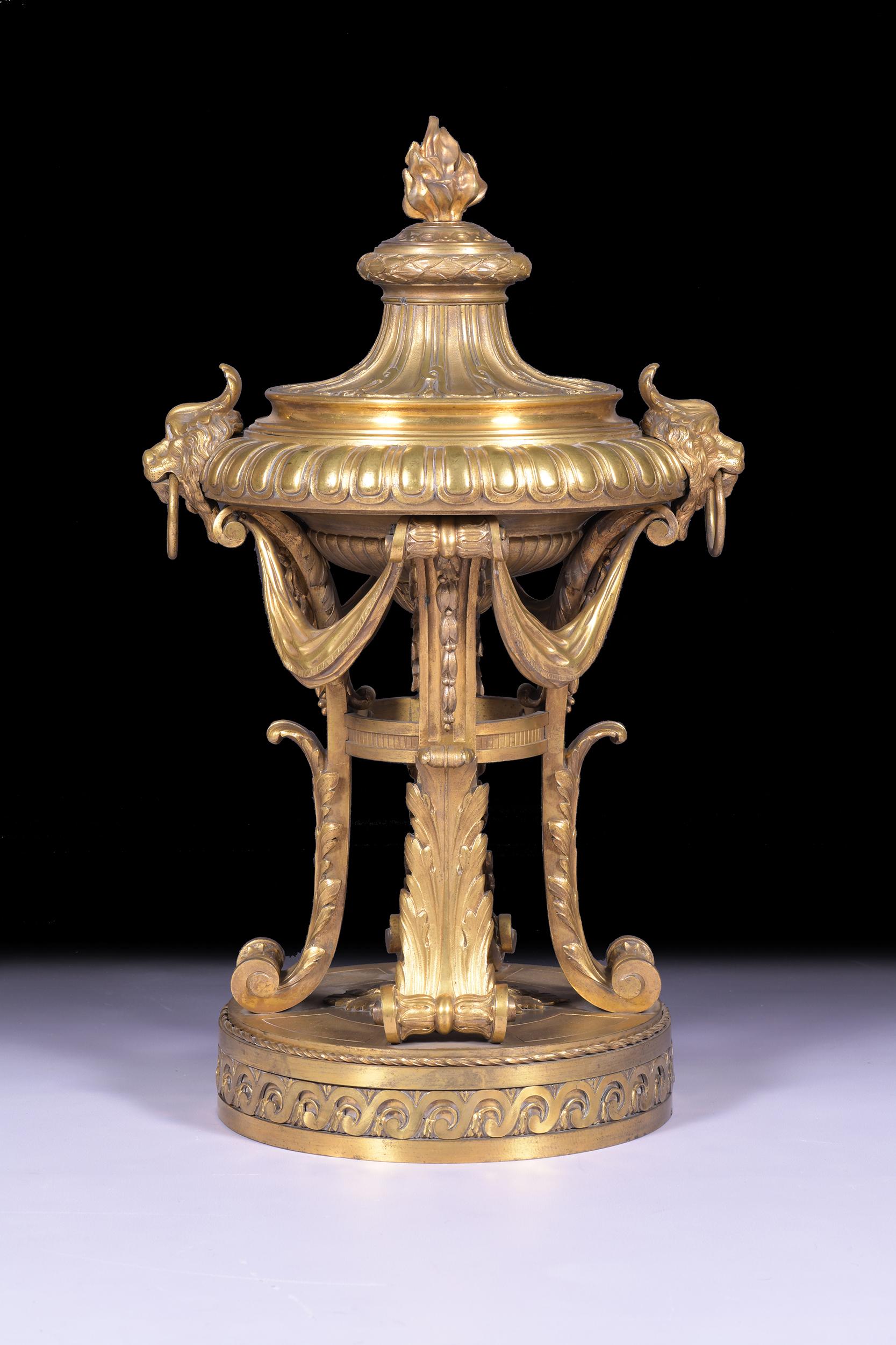 An exceptional quality 19th century Ormolu centre piece in the Louis XVI style. The shallow lobed ogee bowl shaped receiver with lappest cast deep rim below a fluted swept top with laurel wreath border with flambeau finial cover, raised on acanthus