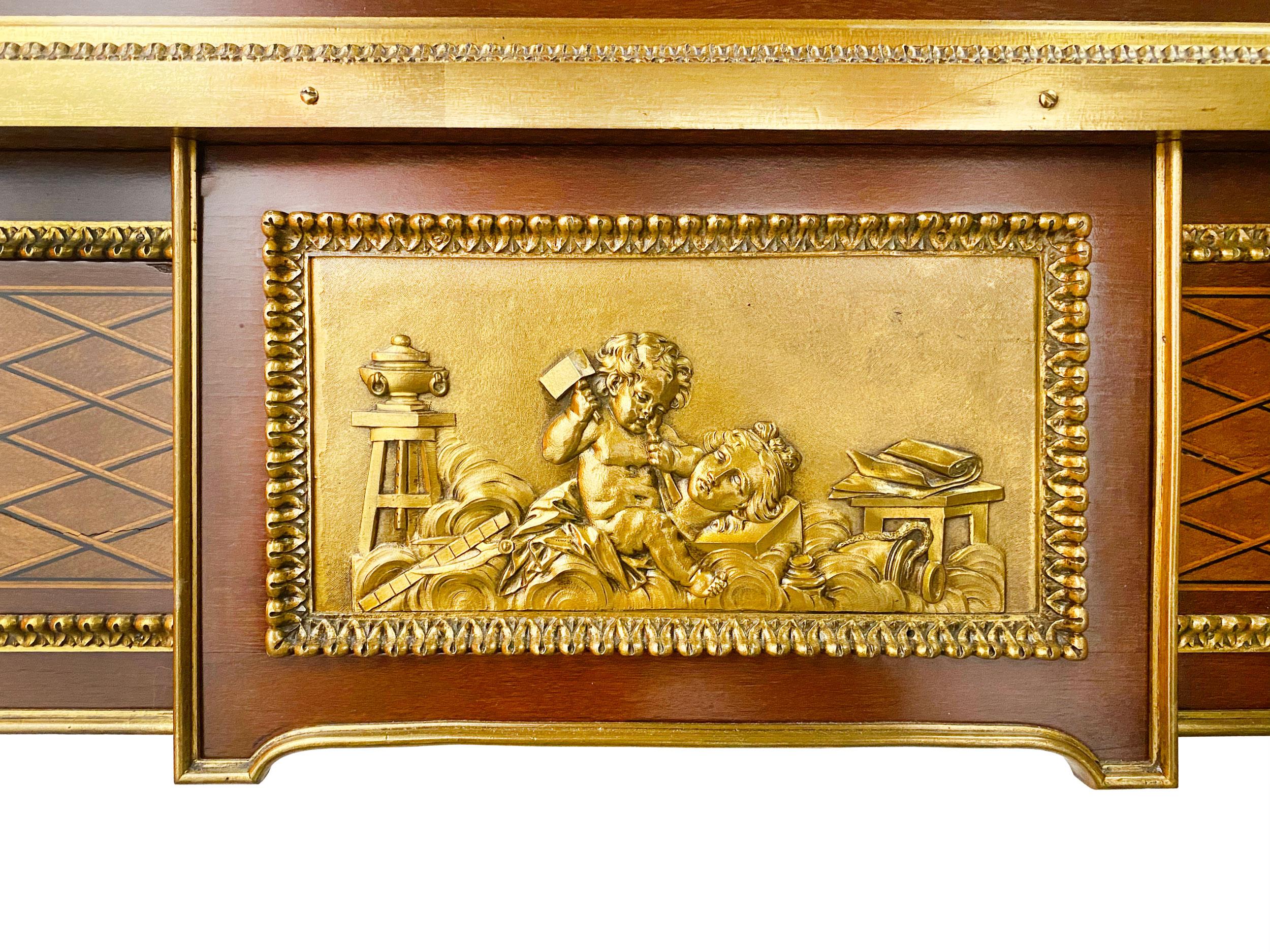 A French ormolu-mounted amaranth, sycamore, marquetry and parquetry bureau a cylindre after the model by Jean-Henri Riesener, by Alfred Beurdeley, Paris, last quarter 19th centuryThe rectangular galleried top inlaid wth lozenge parquetry, above a