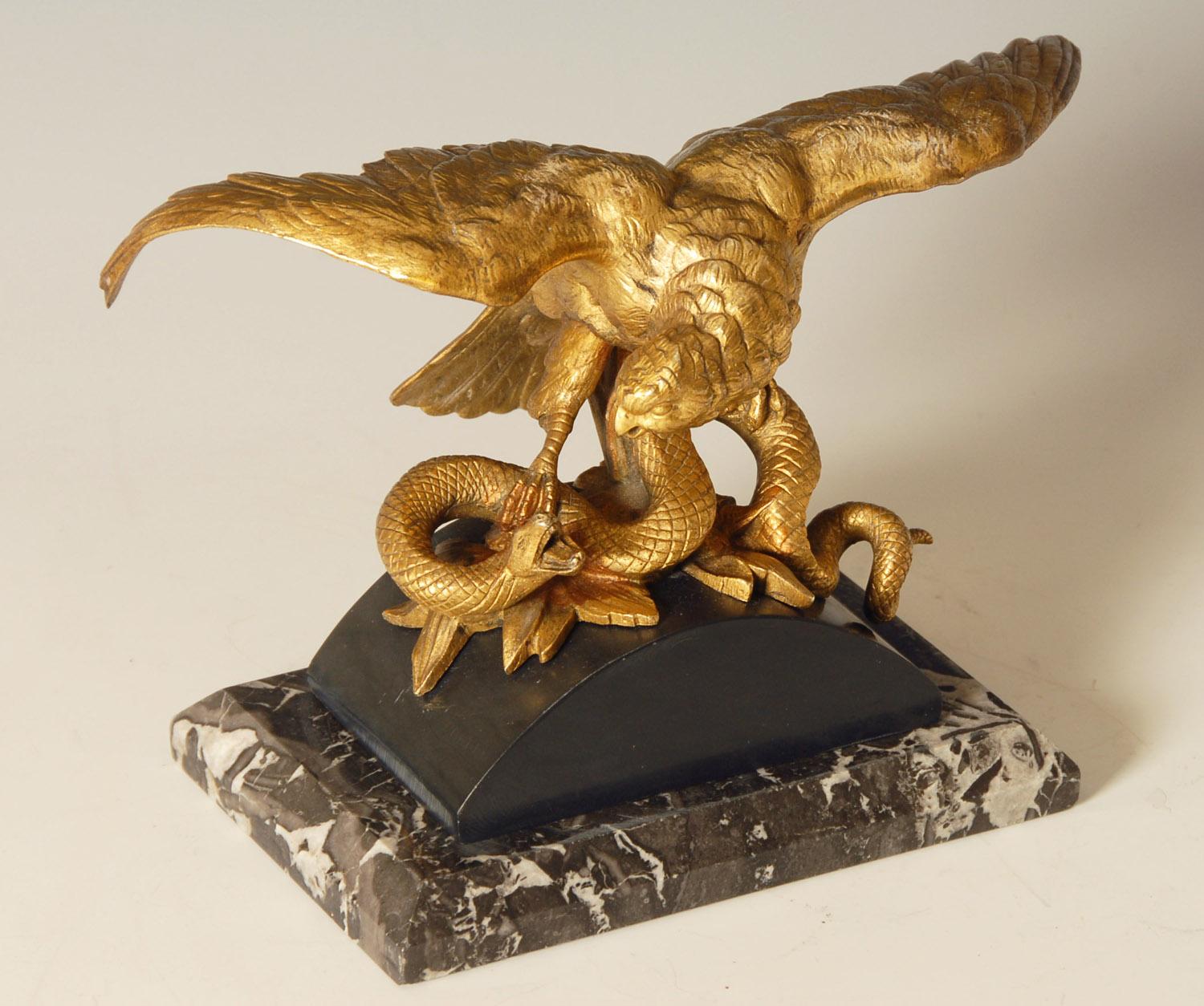 Stunning 19th century French ormolu on bronze study of an eagle attacking a snake on a marble base.
Very fine quality, measures: 6.5 inches high x 10 inches wide, weighing 3.7 kilos, a perfect desk accessory.

Price includes free shipping to
