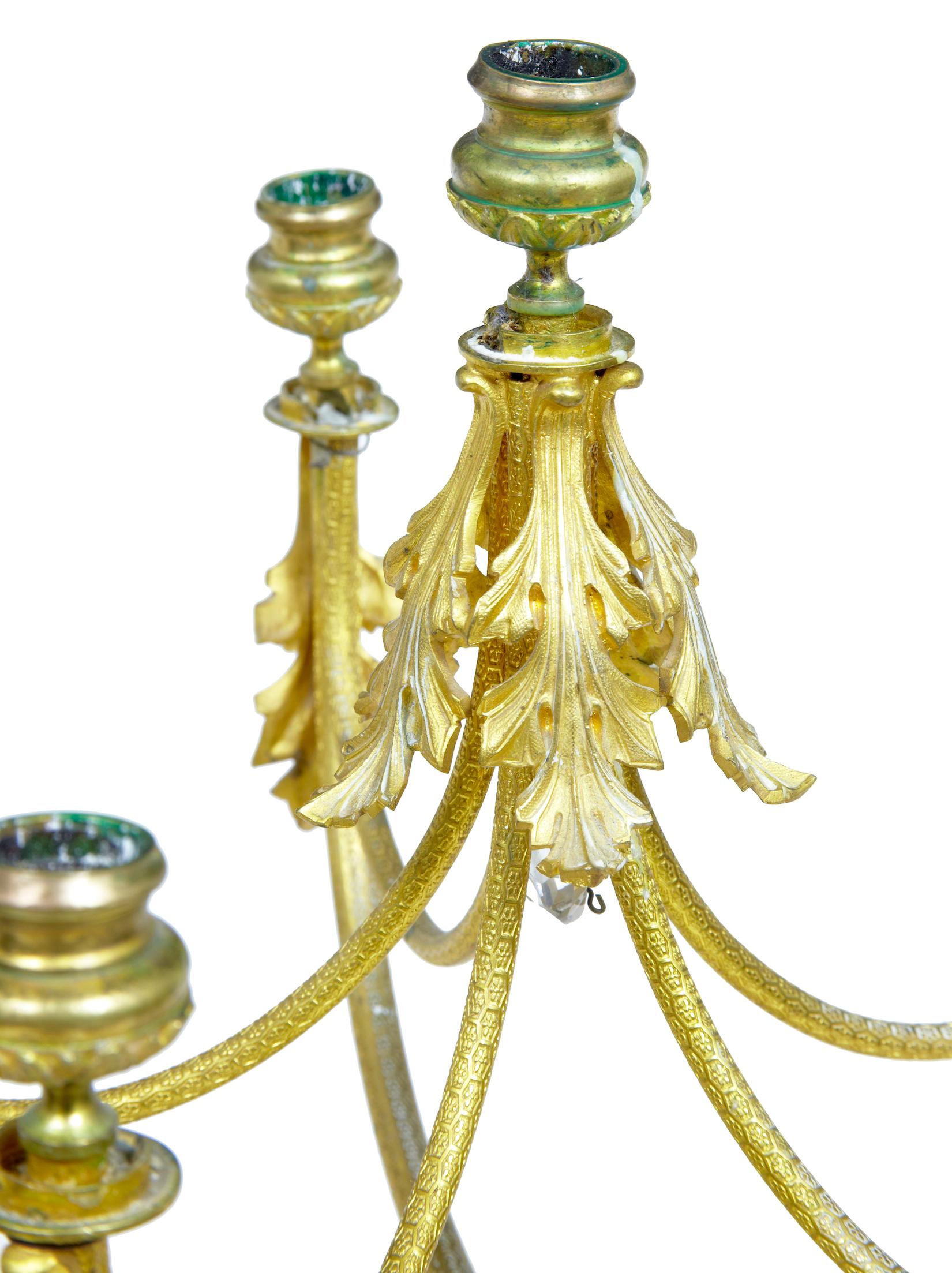 19th century French ormolu six-candle candelabrum, circa 1880.

Fine quality chiseled ormolu craftsmanship on this piece. Stamped with a hexagonal pattern all-over. Six arms, five on the lower tier and a further arm in the center in an elevated