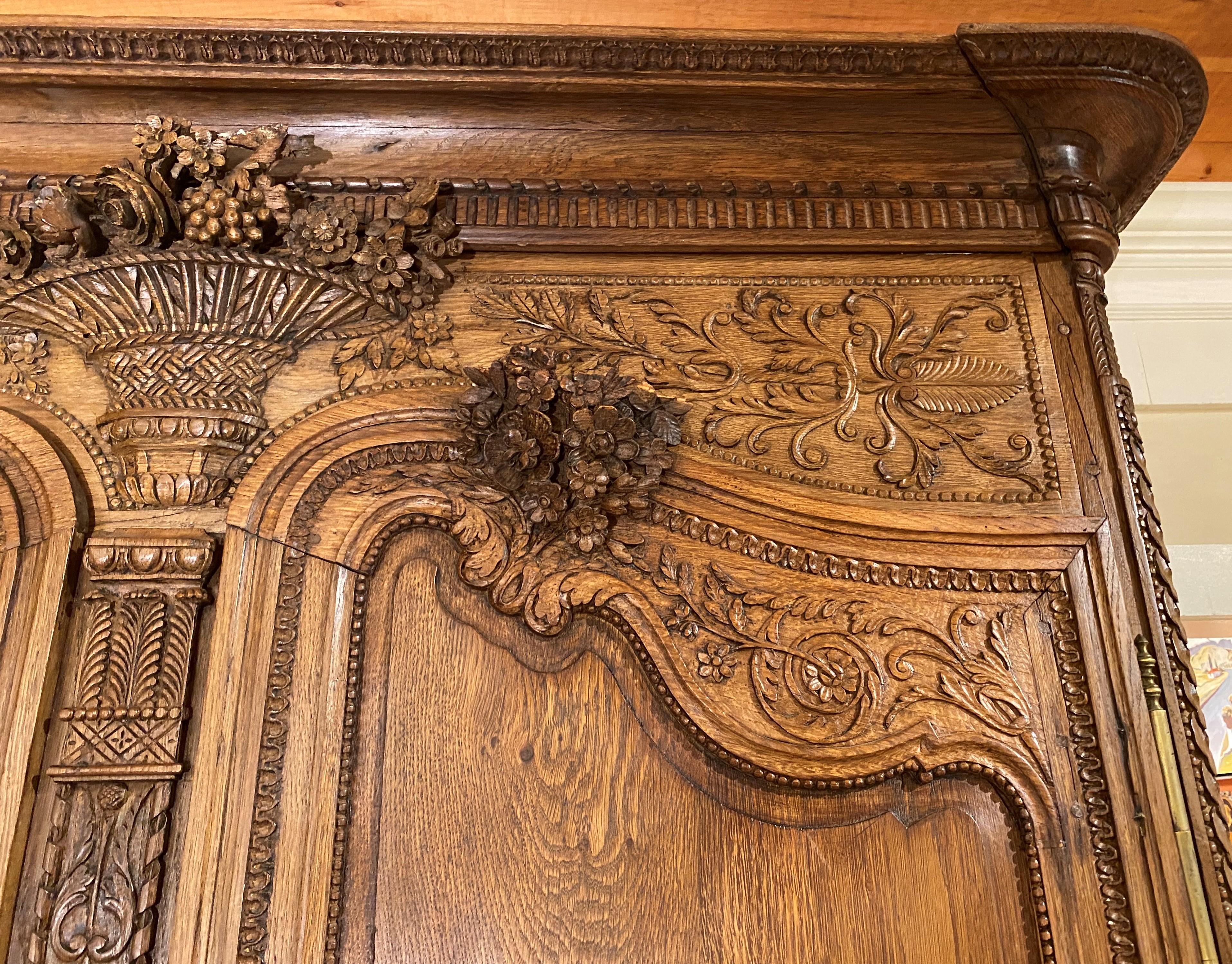 French Provincial 19th Century French Ornately Carved Oak Armoire