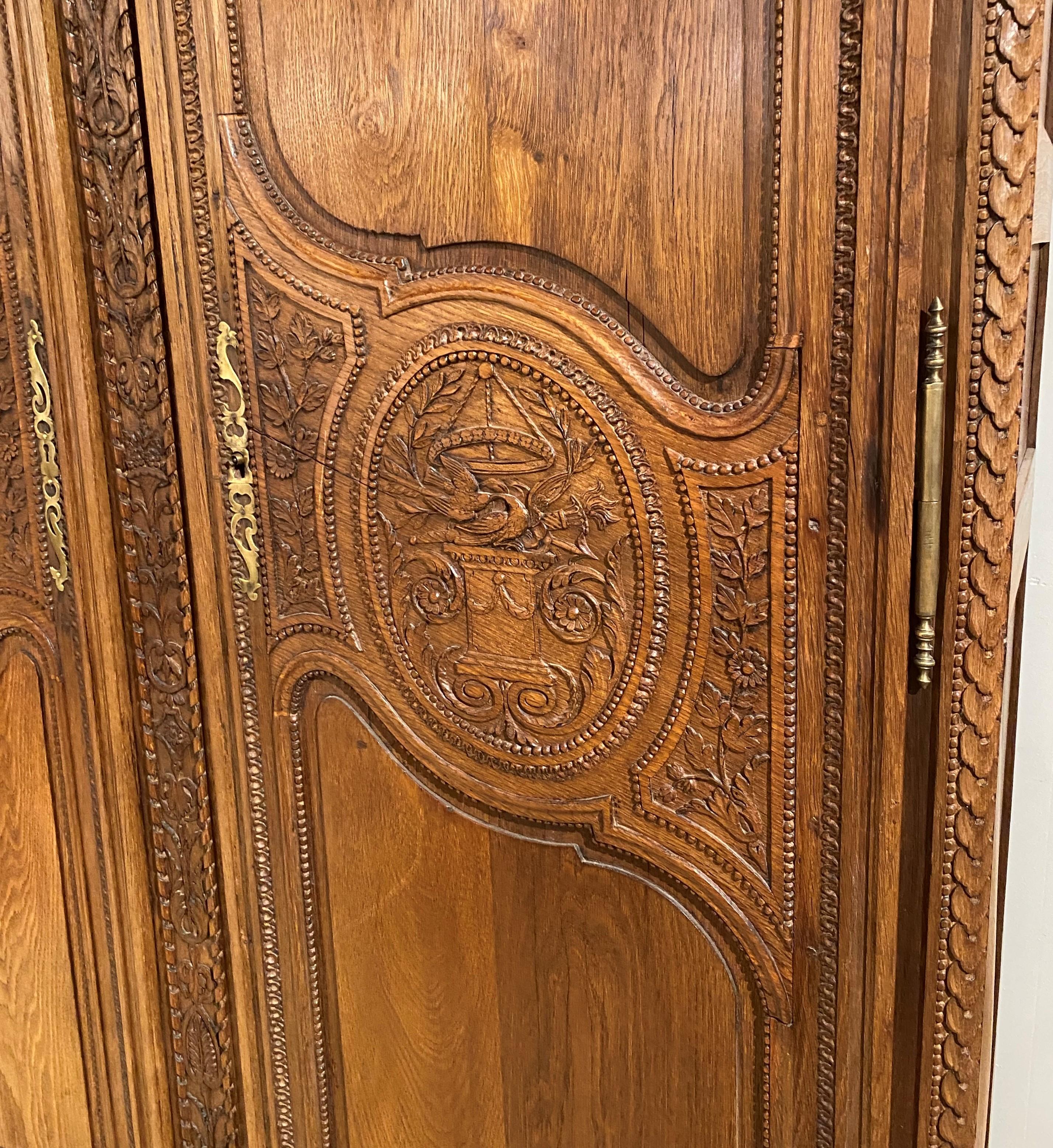 Appliqué 19th Century French Ornately Carved Oak Armoire