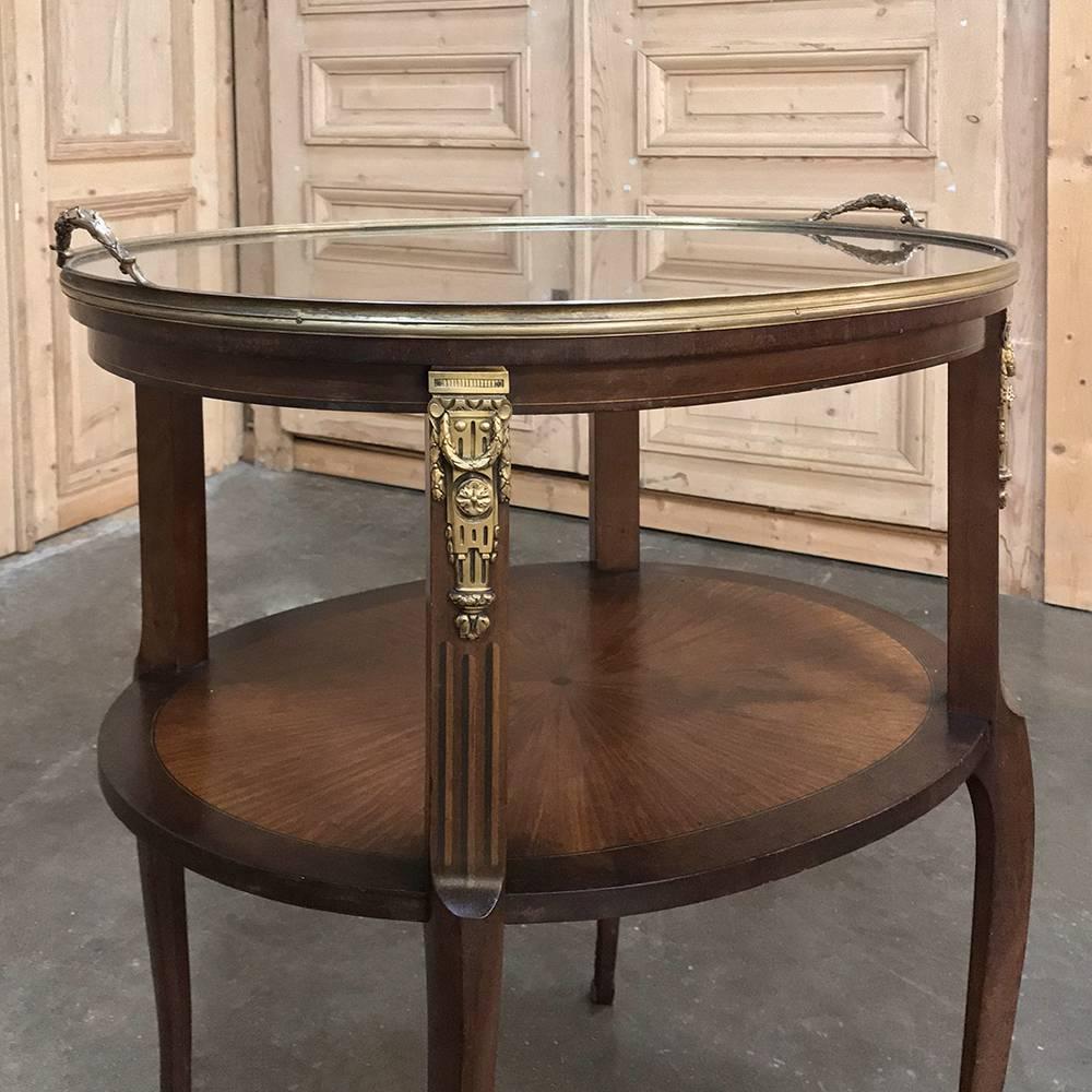 19th century French oval occasional  table with Marquetry and Ormolu and glass serving tray also makes a great choice as a coffee or tea serving table! Radial grain patterns were expertly installed on the tops, with inlaid border below and brass rim