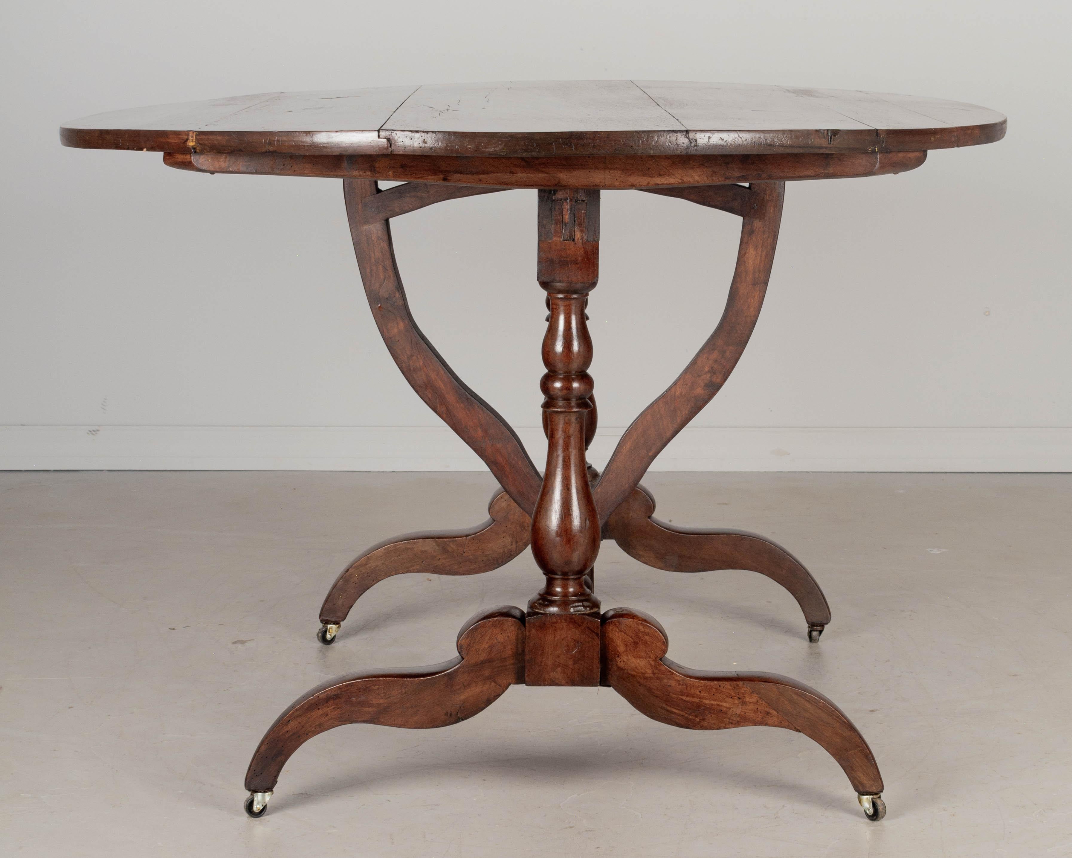 Walnut 19th Century French Oval Dining Table or Tilt Top Table For Sale
