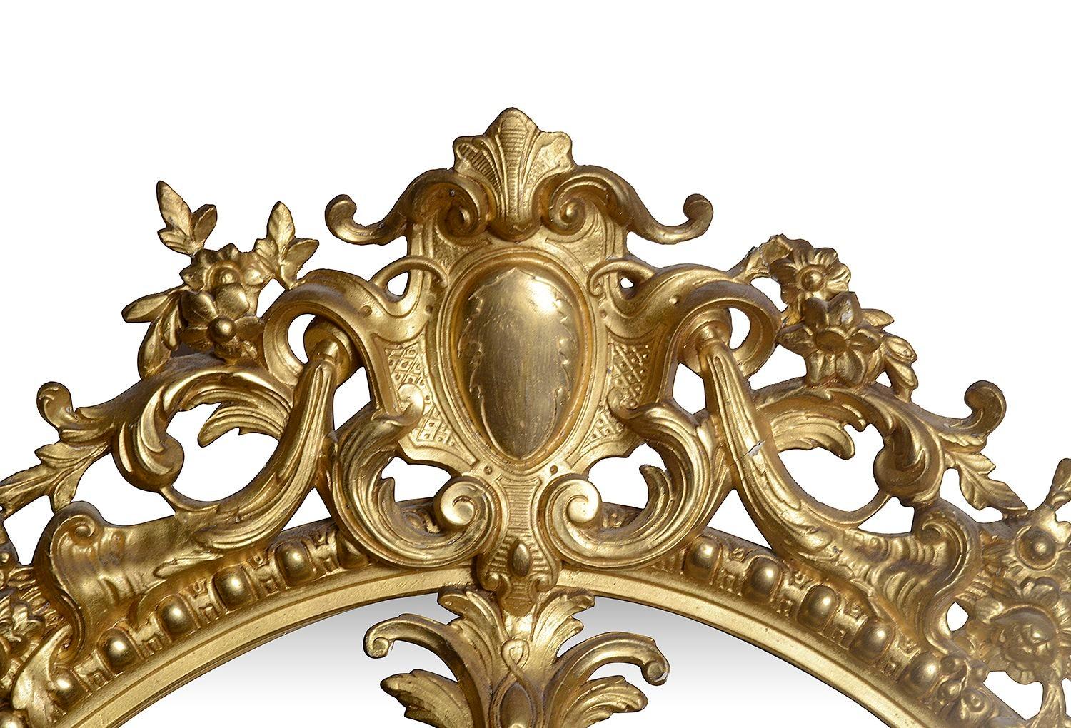 Gilt 19th Century French Oval gilded wall mirror. For Sale
