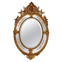 Miroir ovale Louis XVI du 19ème siècle avec panneaux latéraux gravés