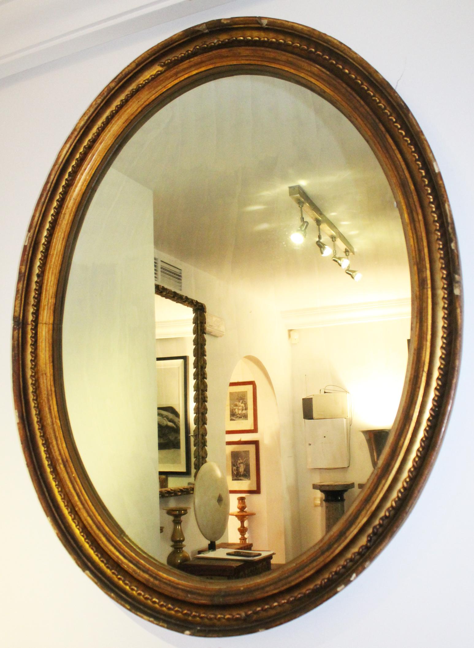 Mid-19th Century 19th Century French Oval Mirror Gilded with Gold Leaf