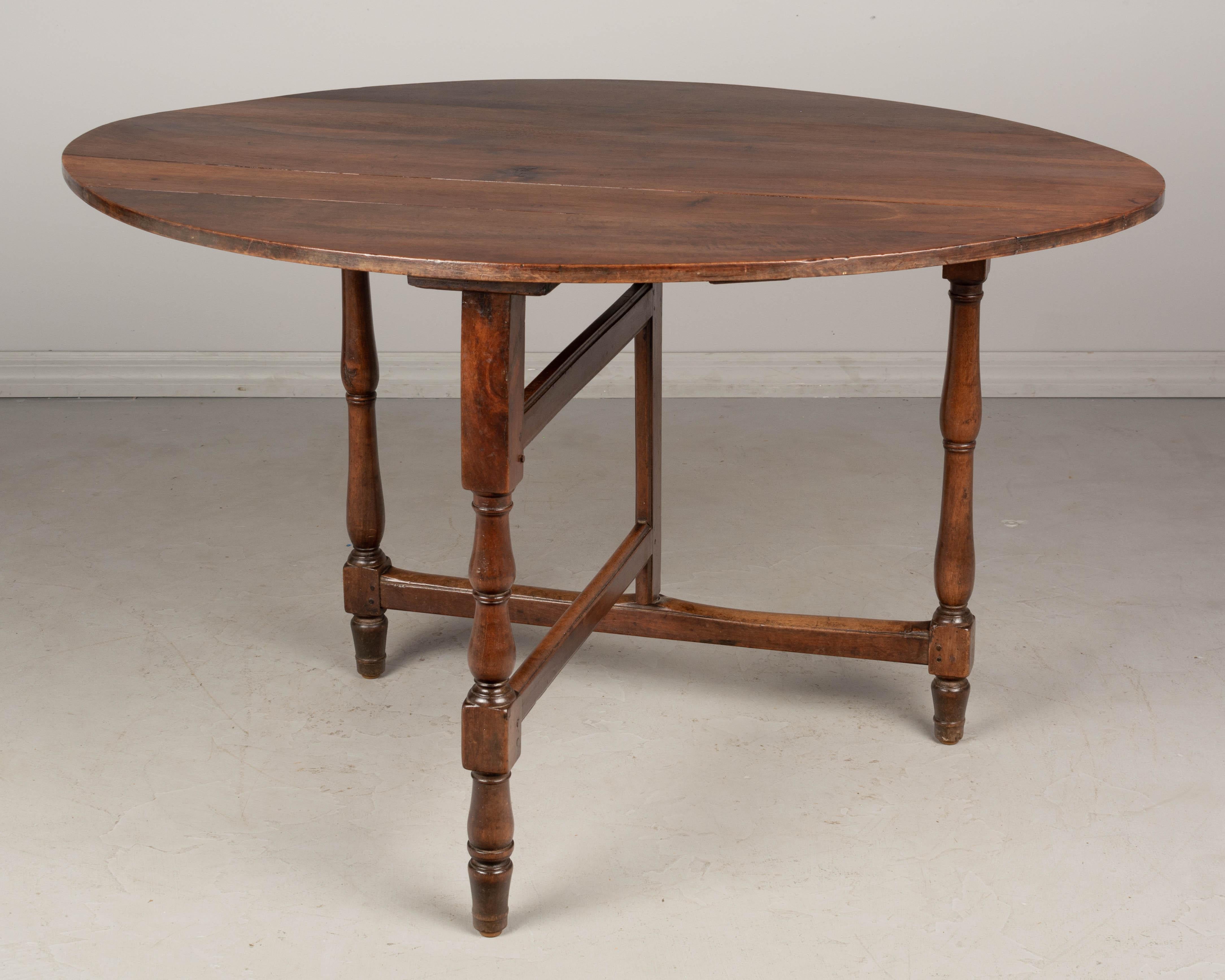 Louis Philippe 19th Century French Oval Walnut Folding Table