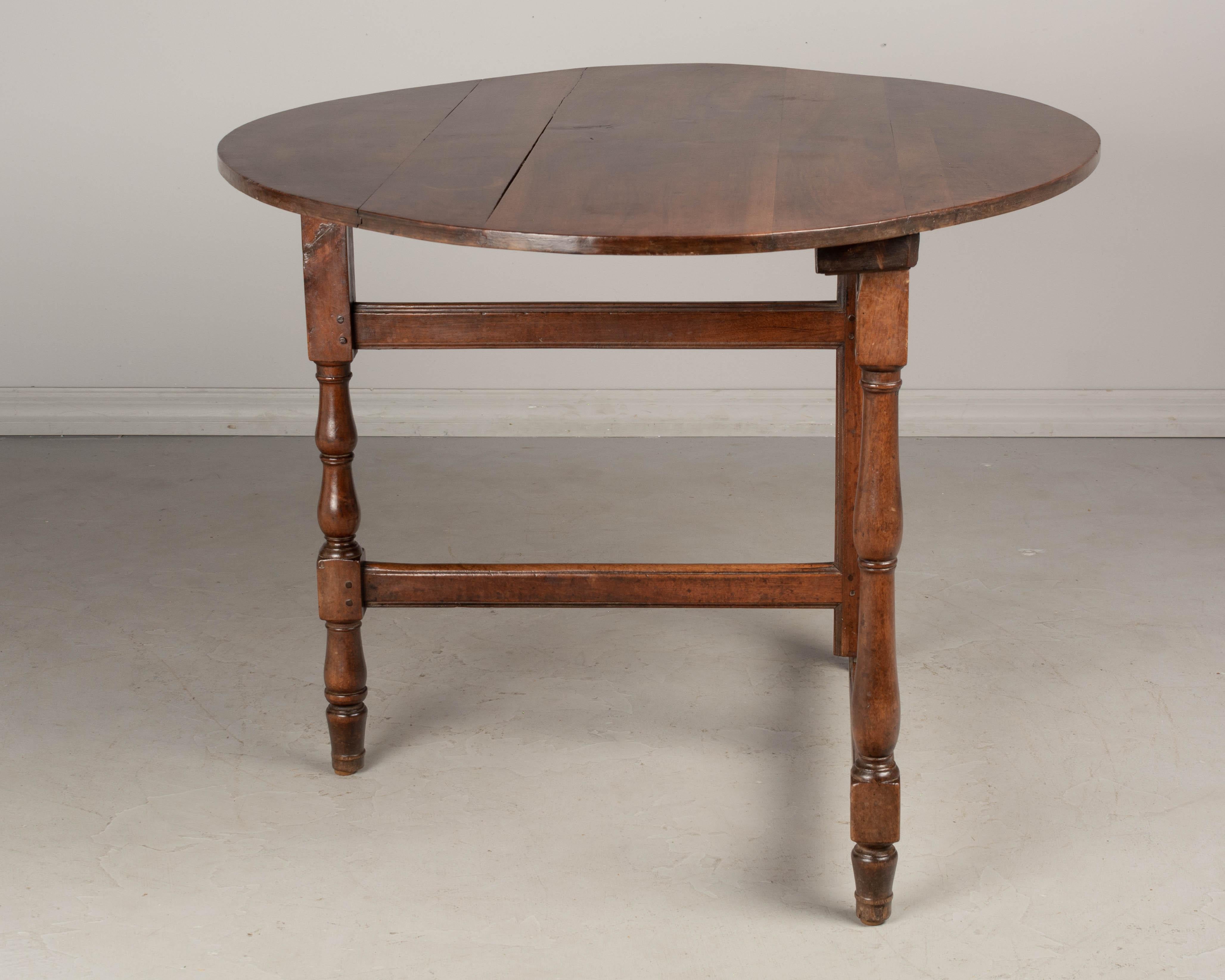 19th Century French Oval Walnut Folding Table In Good Condition In Winter Park, FL