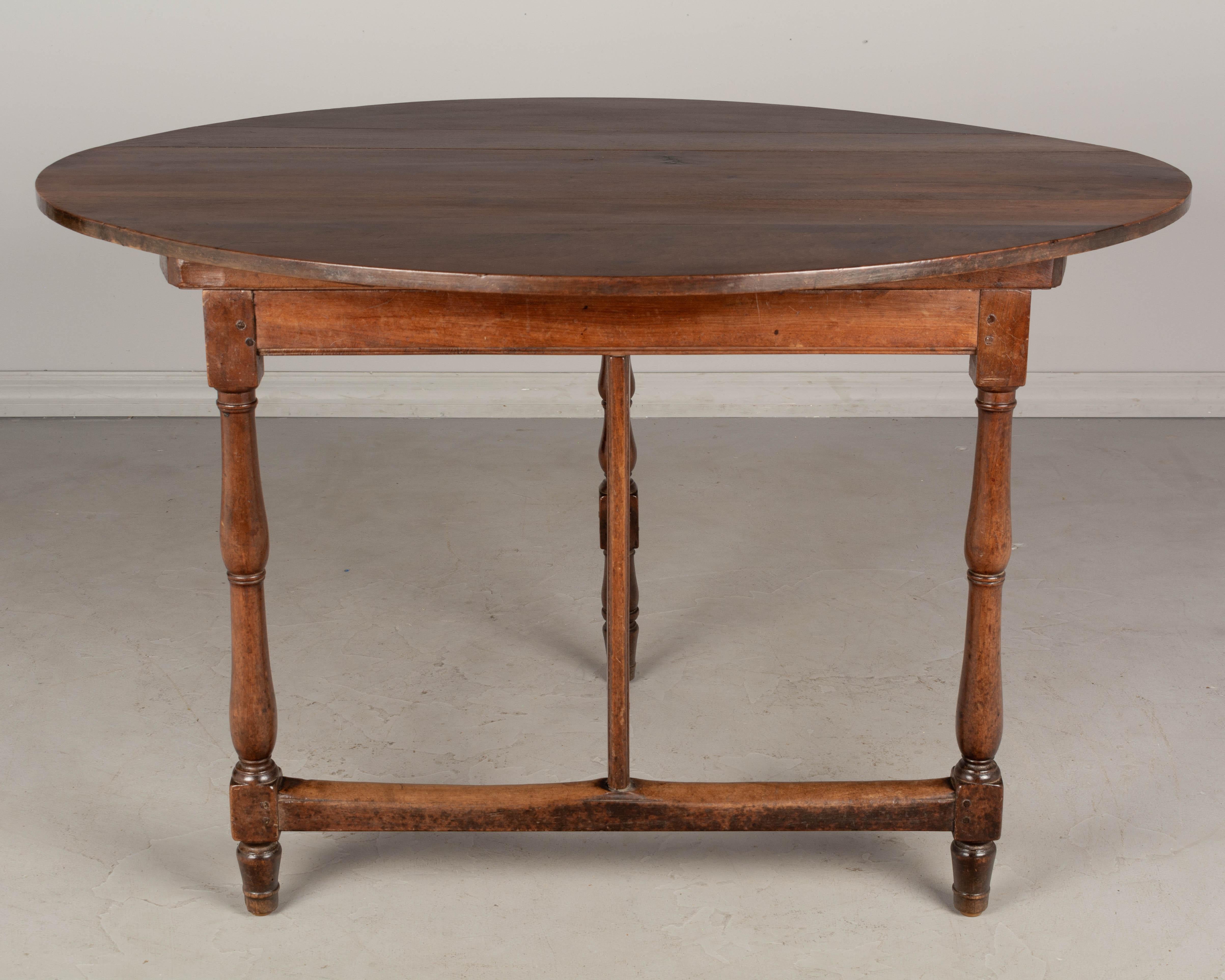 19th Century French Oval Walnut Folding Table 2