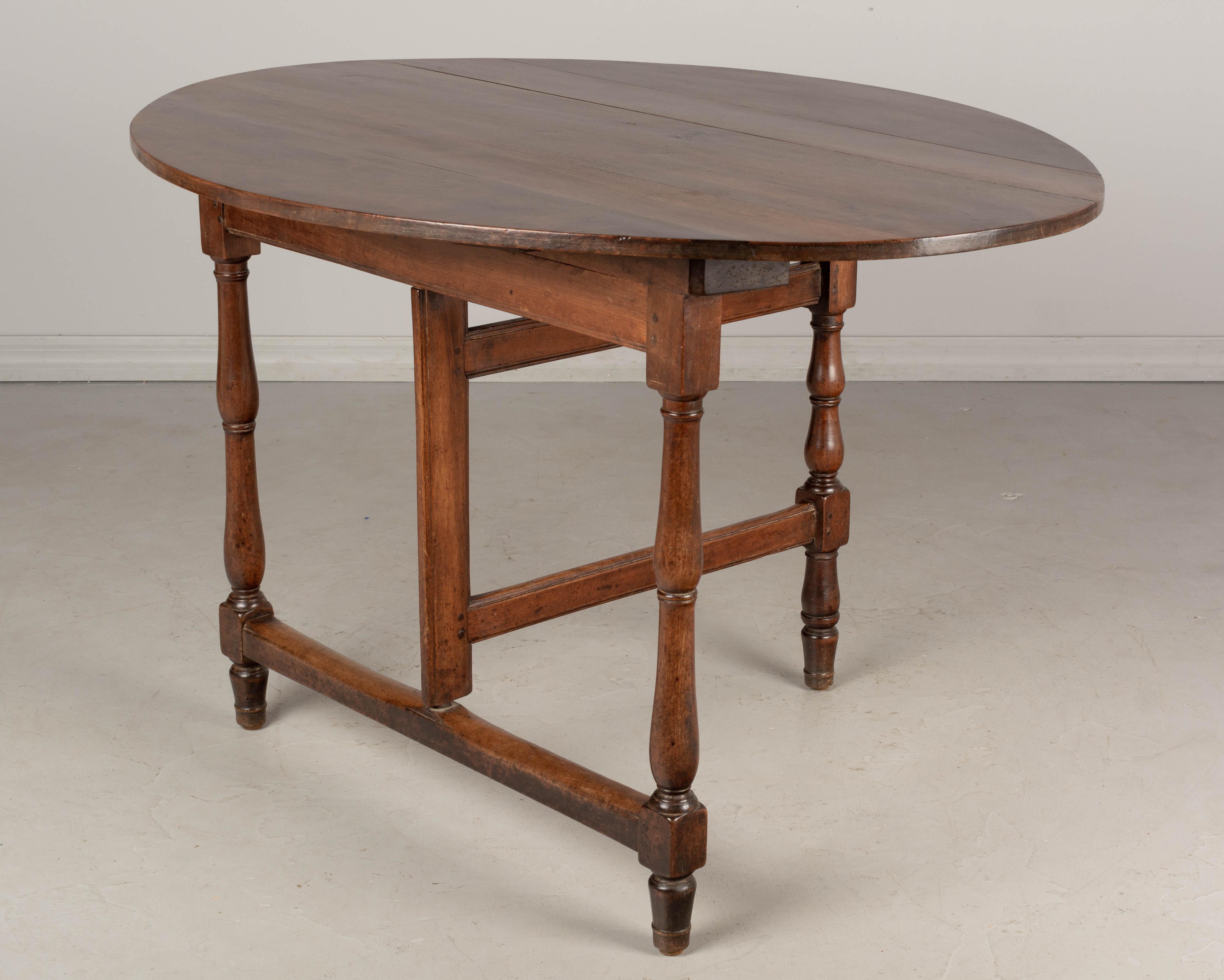 19th Century French Oval Walnut Folding Table 3