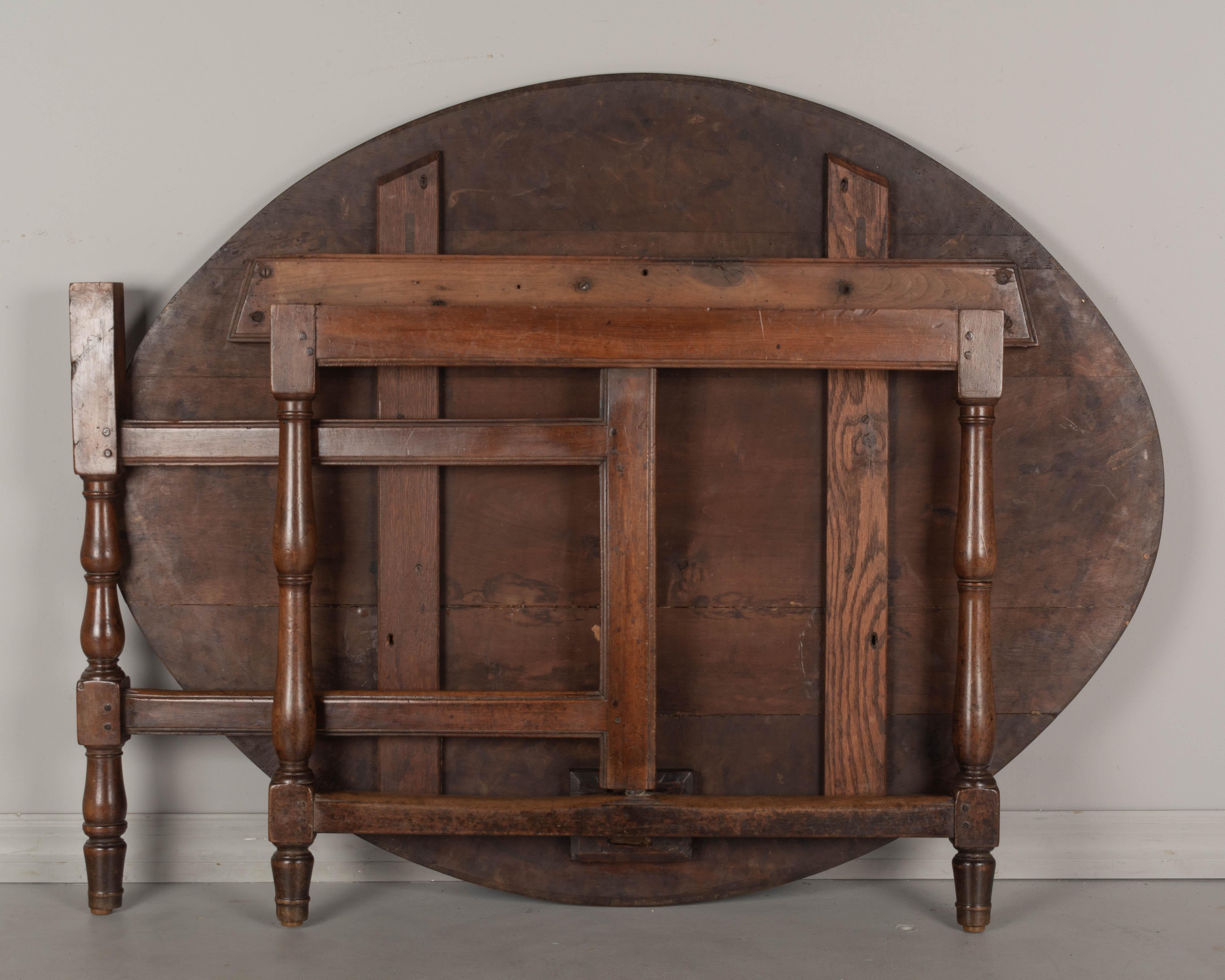 19th Century French Oval Walnut Folding Table 4