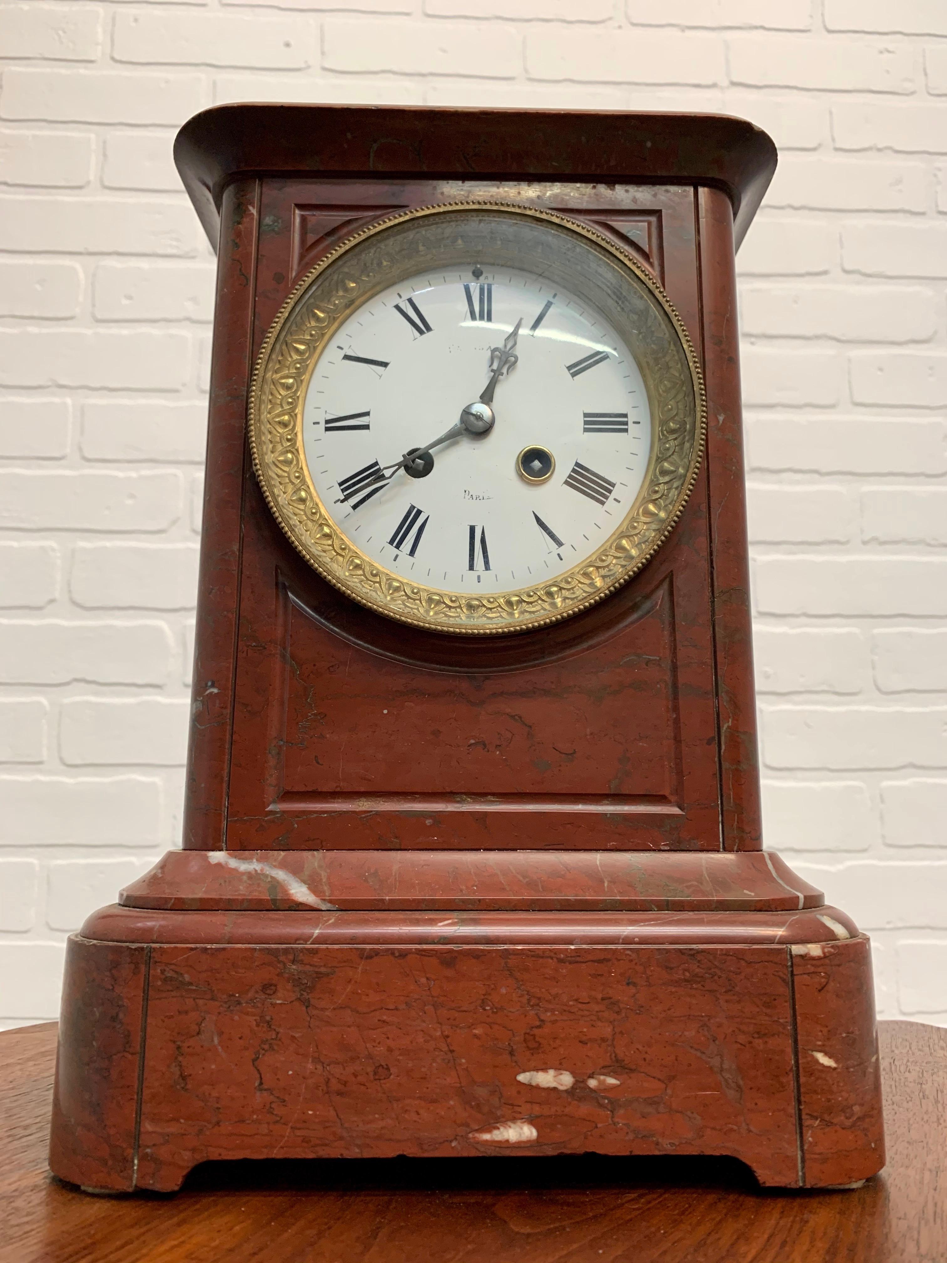 Marble architectural case with a Pomme de Paris clock movement that strikes a bell on the hour and half hour, in very good running condition.