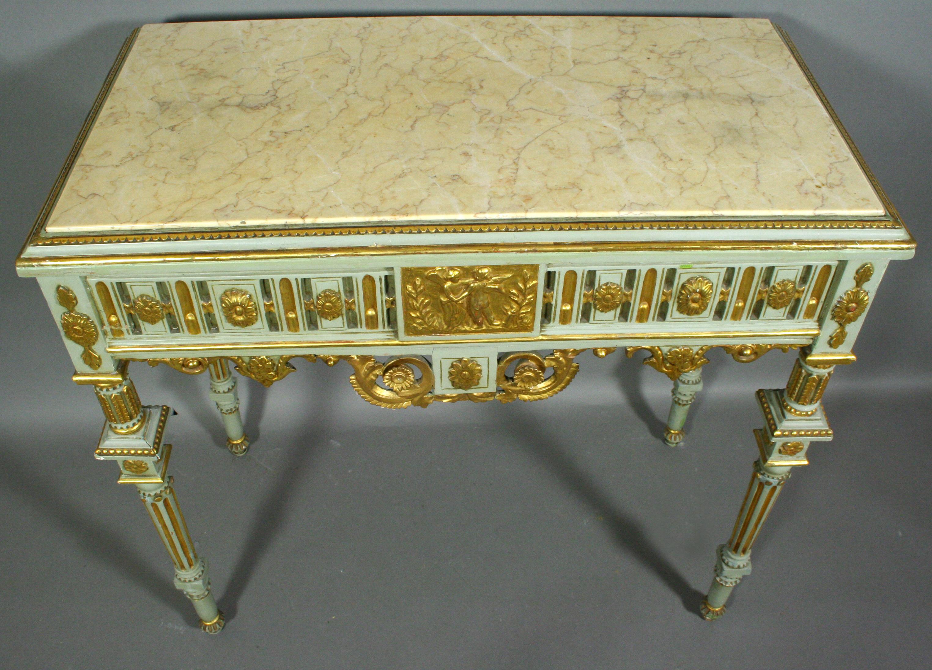 19th century gilt and green painted carved console table with gilt putti decoration, rosette, and scroll design.