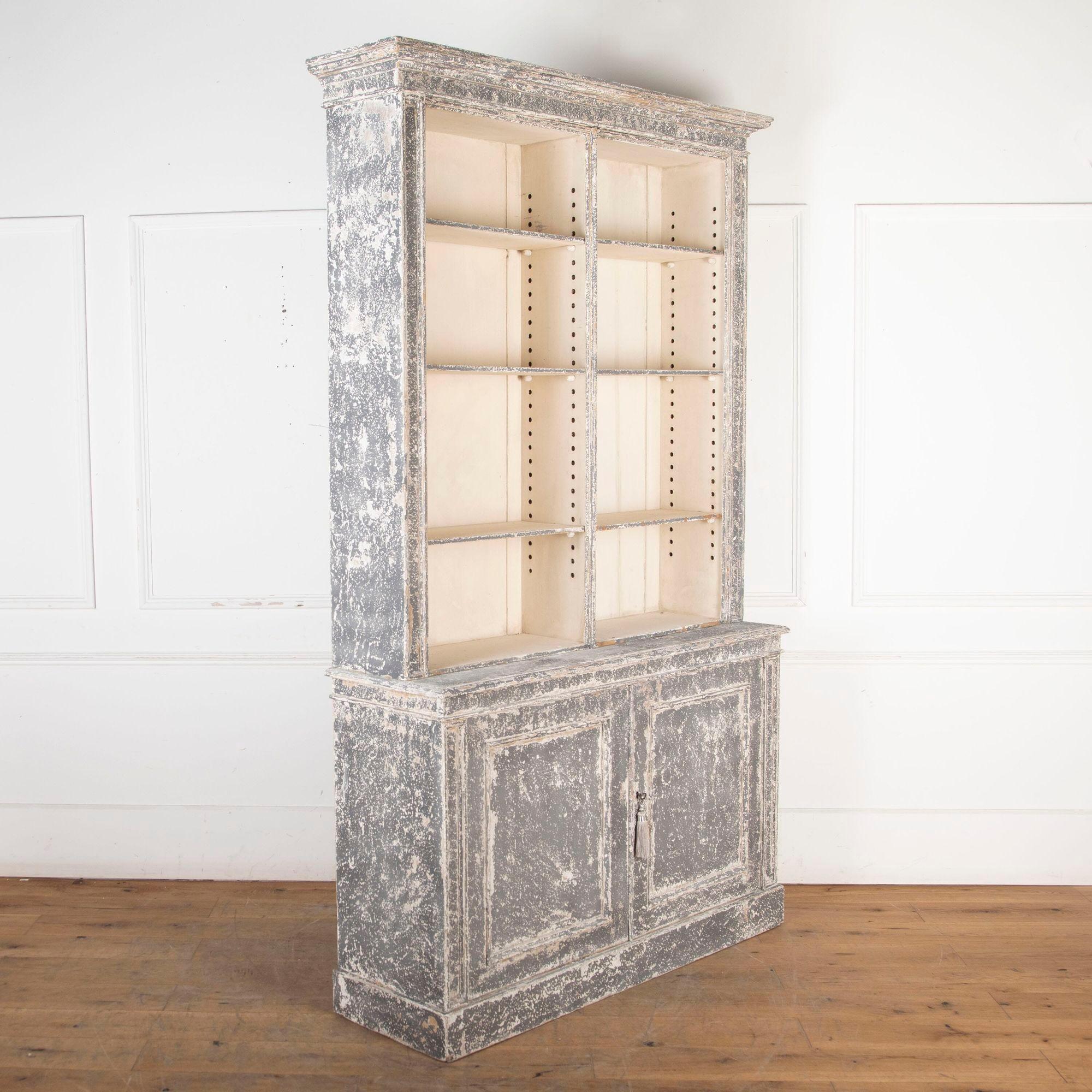 19th century French painted open bookcase with door to the bottom.
With adjustable shelves throughout. 
Circa 1860.