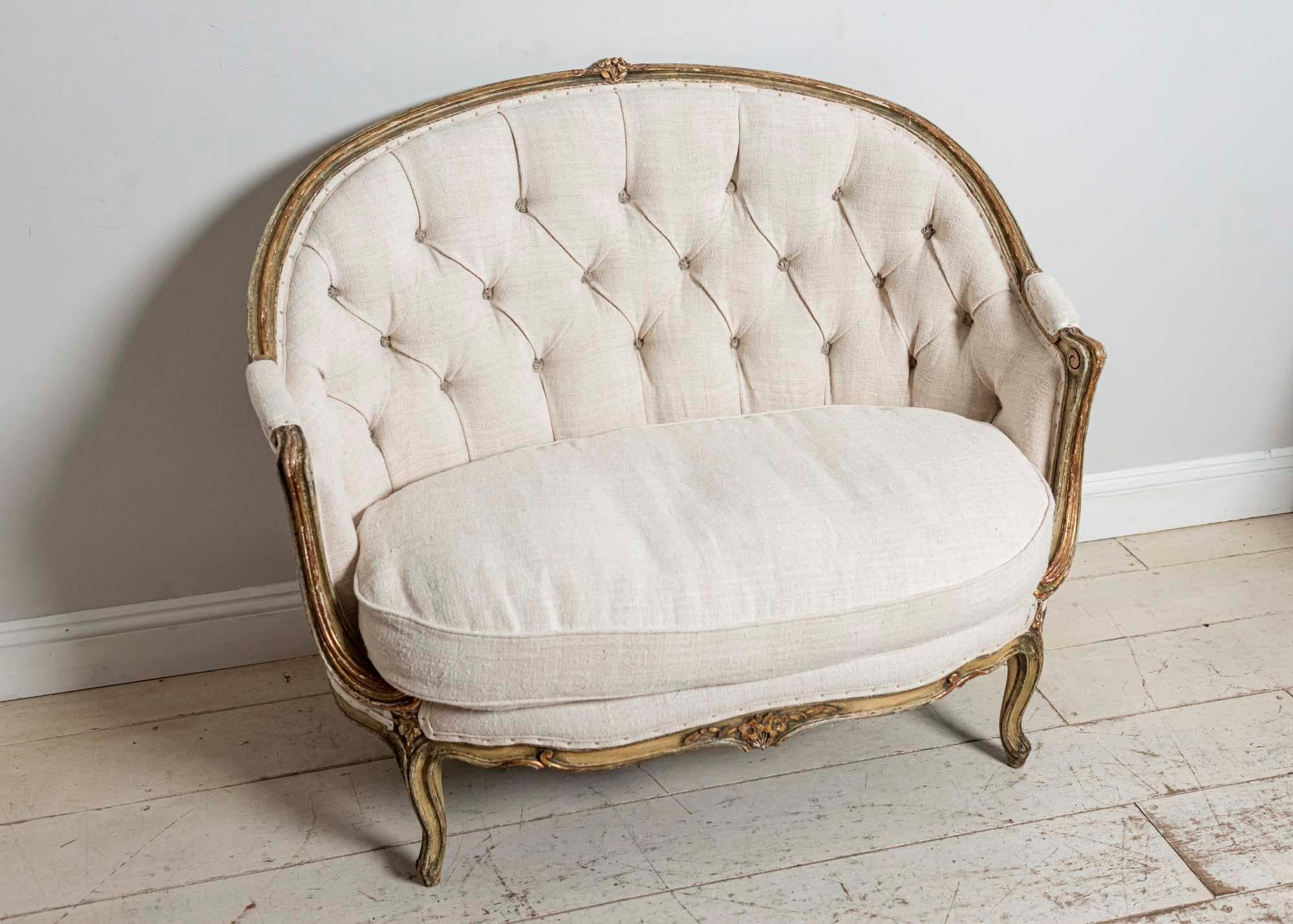 Neoclassical 19th Century French Painted Button Backed Linen Two-Seat Carved Curved Sofa