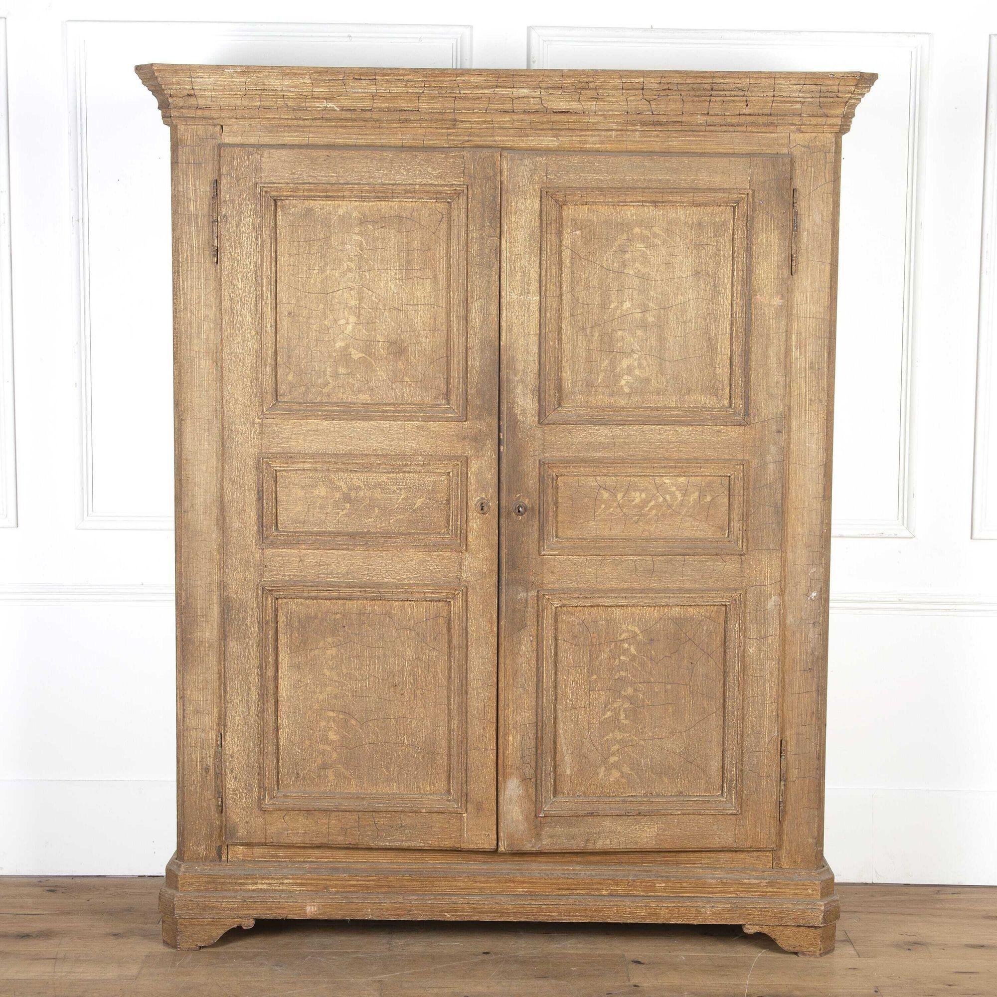 French two-door painted cupboard. 
This lovely example of French craftsmanship has two interior shelves which are perfect for storage. Featuring its original paintwork that is attractively time-worn. The exterior has developed a decorative crackled