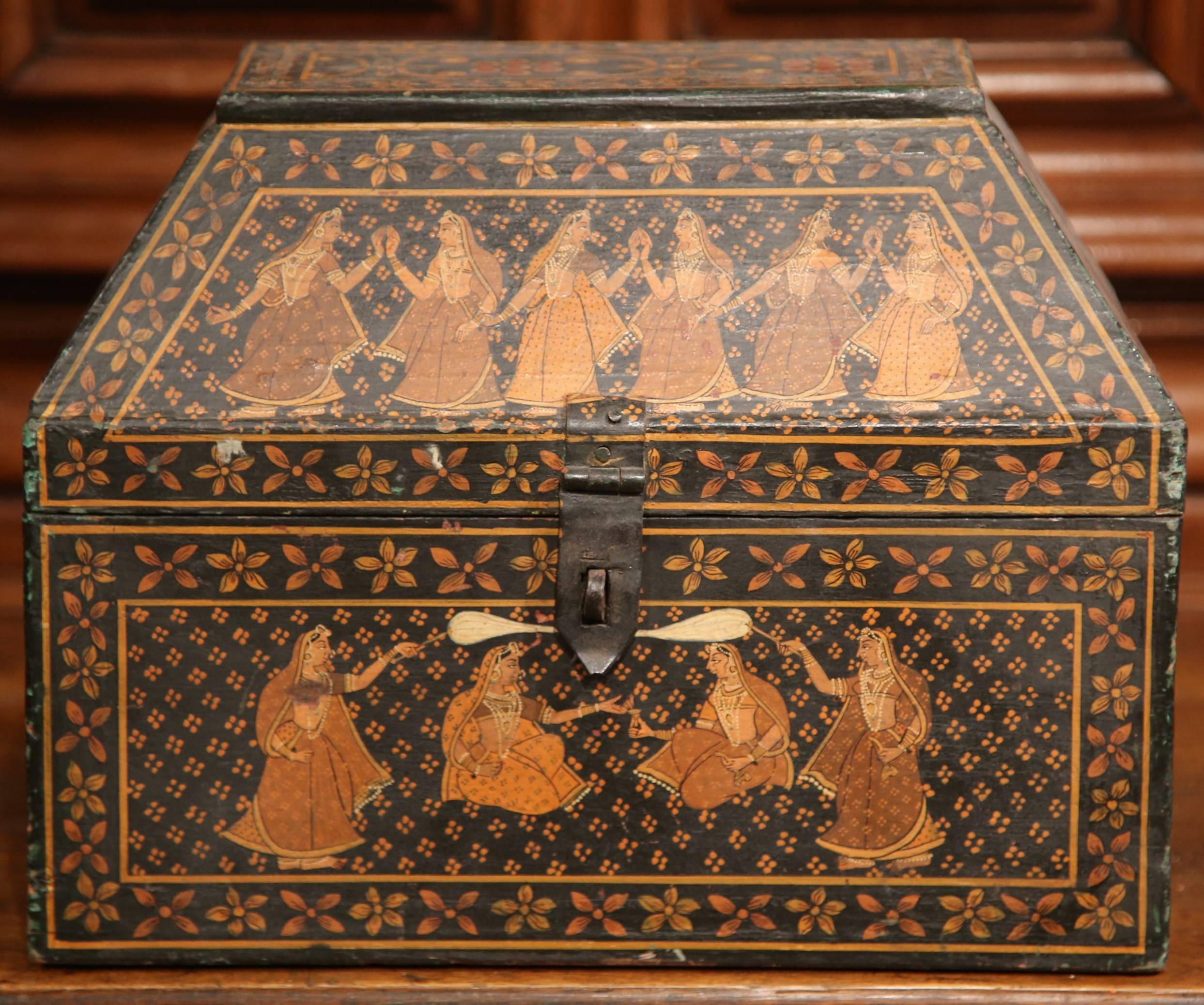 This beautifully painted antique box was crafted in France, circa 1870. The chest features hand painted women wearing oriental clothes and dancing. The groups of figures are further embellished by decorative bands of painted flowers. Interesting in