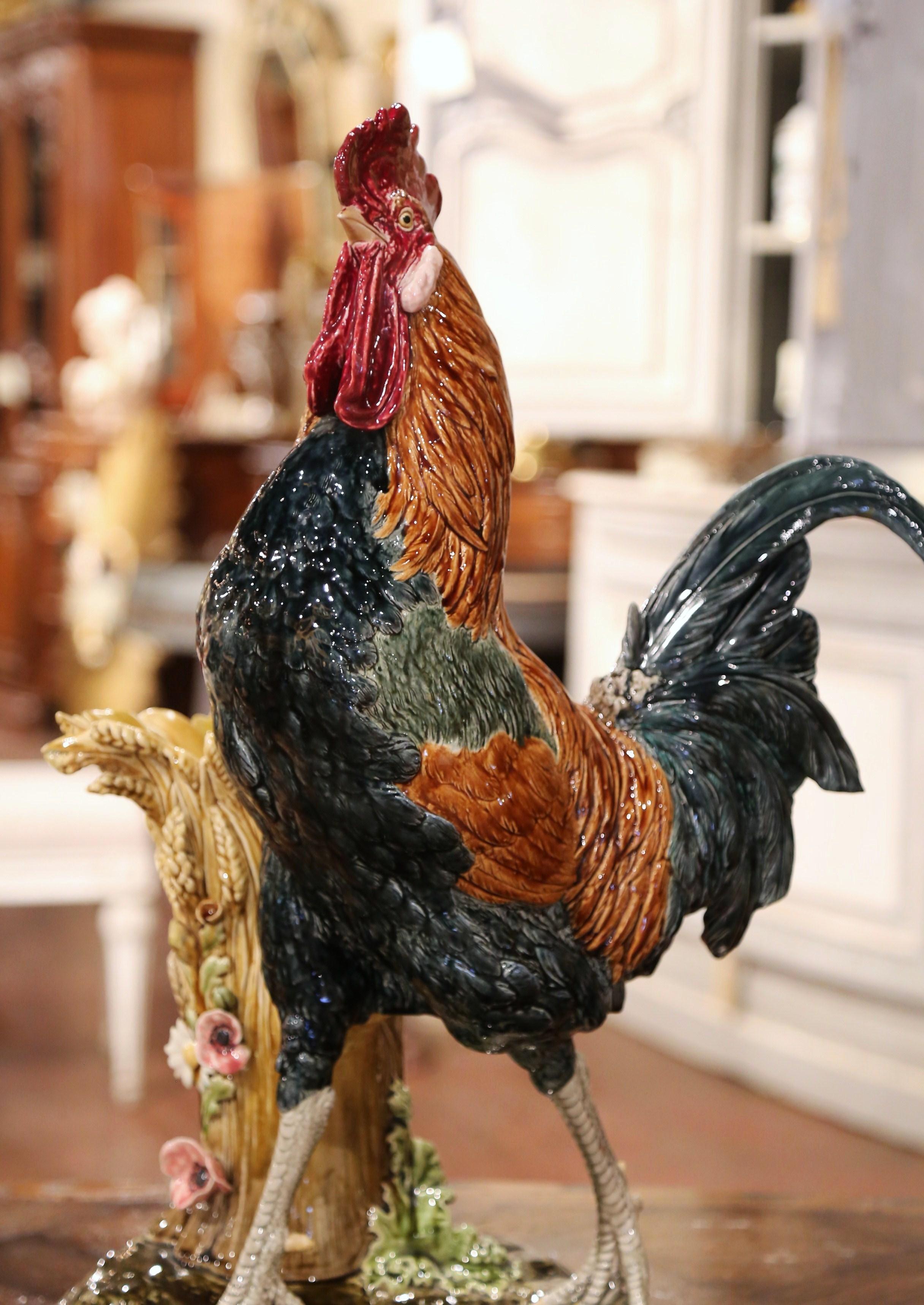 Add the charm of the French countryside to your home with this large, colorful and rare ceramic rooster sculpture. Crafted in France circa 1880, the Majolica composition is at once a flower vase and a rooster sculpture. The elegant faience piece