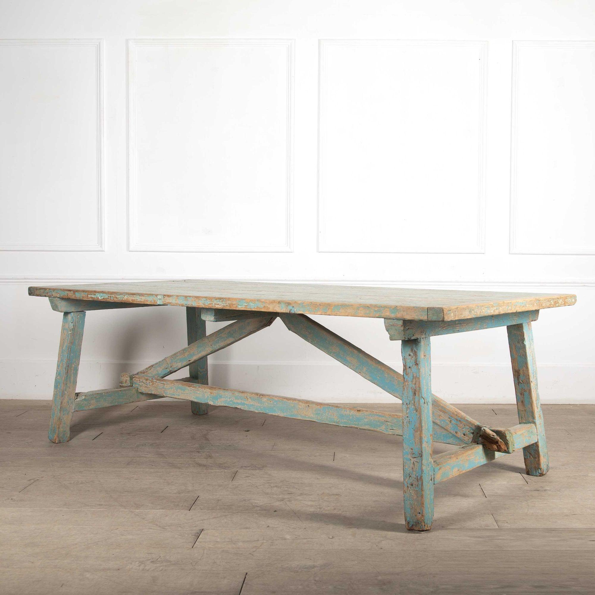 Striking Mid-19th Century French pine farmhouse dining table.
With a stunning thick top and wearing an old 20th century powder blue paint finish and rustic repairs to the base.
circa 1840.